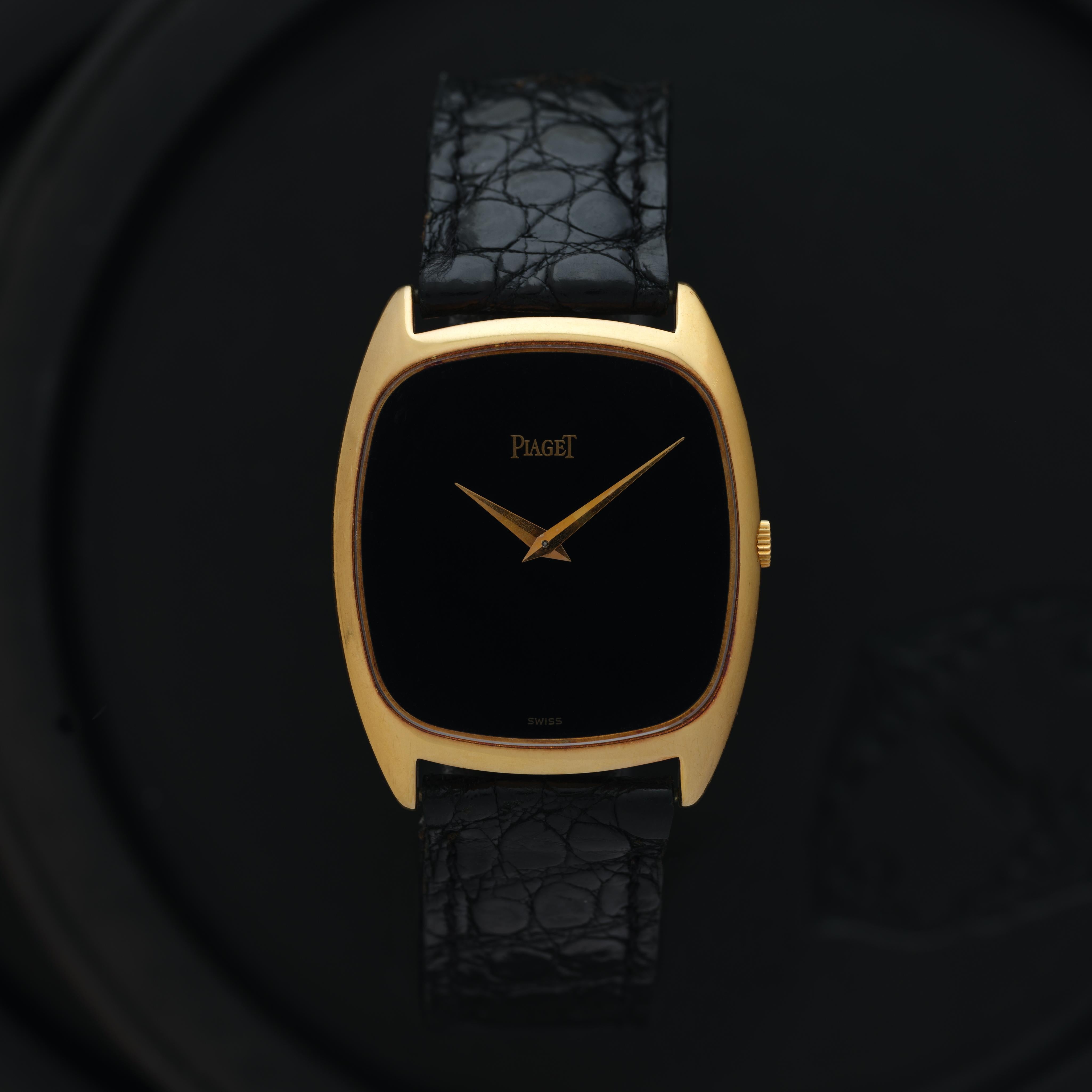 Maker: Piaget
Model: 9591 Emperador
Year: 1970s
Material: 18k Yellow Gold and Onyx and on 18k Yellow Gold Deployment Buckle
Dial: Onyx
Case Measurement: 29mm
Movement: Manual Wind
Condition: Very good
Weight:  Grams
Size: Fits a 7.5