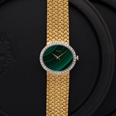 Vintage Piaget Model 9806 D2 18 Karat Yellow Gold Diamond Bezel Malachite Dial
