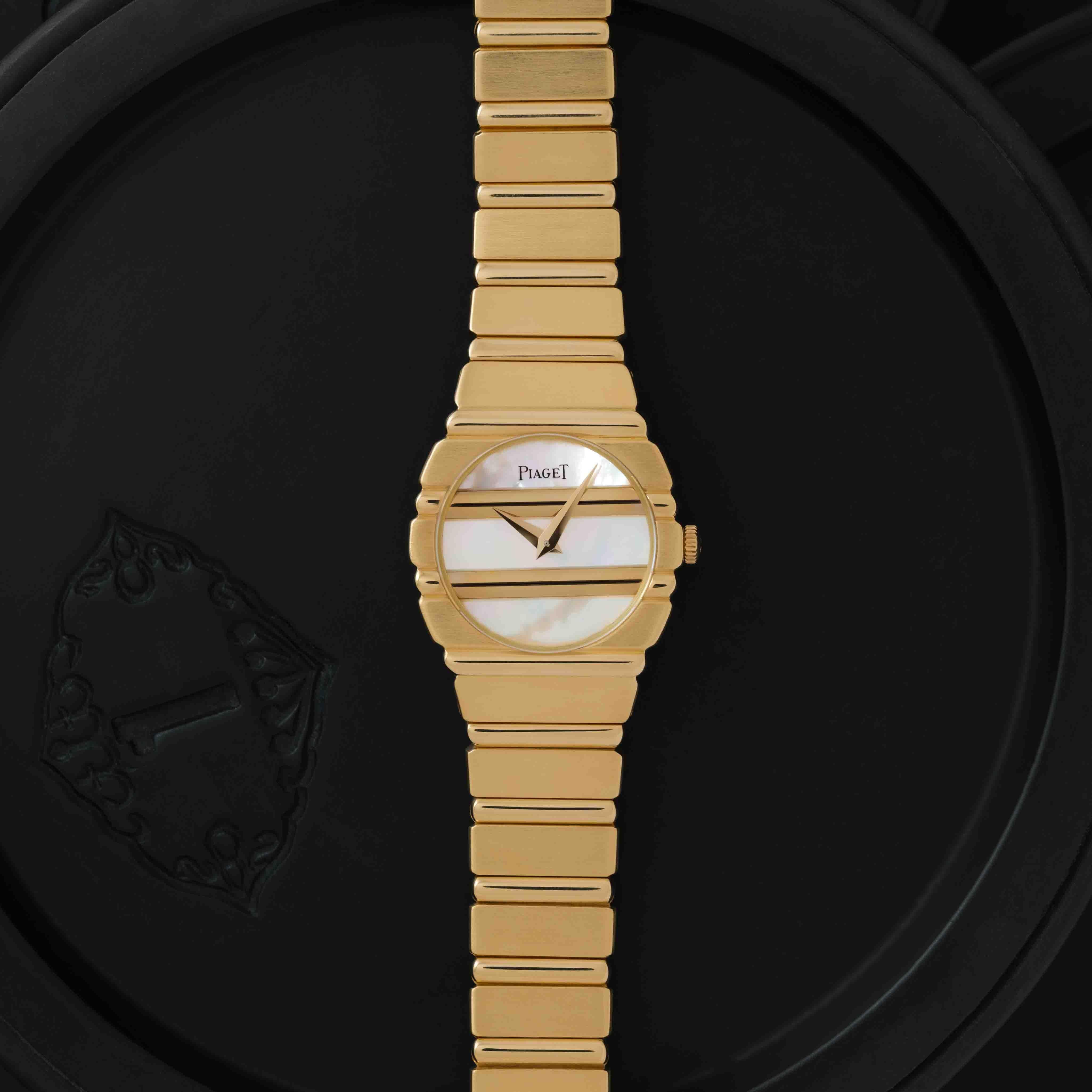 Maker: Piaget
Model: Polo 861 C 701
Year: 1980s
Material: 18k Yellow Gold
Dial: Mother-of-Pearl
Case Measurement: 23mm
Movement:  Quartz
Condition: Very good vintage condition. 
Weight: 90 Grams
Size: Adjustable, Fits Up to 7.0