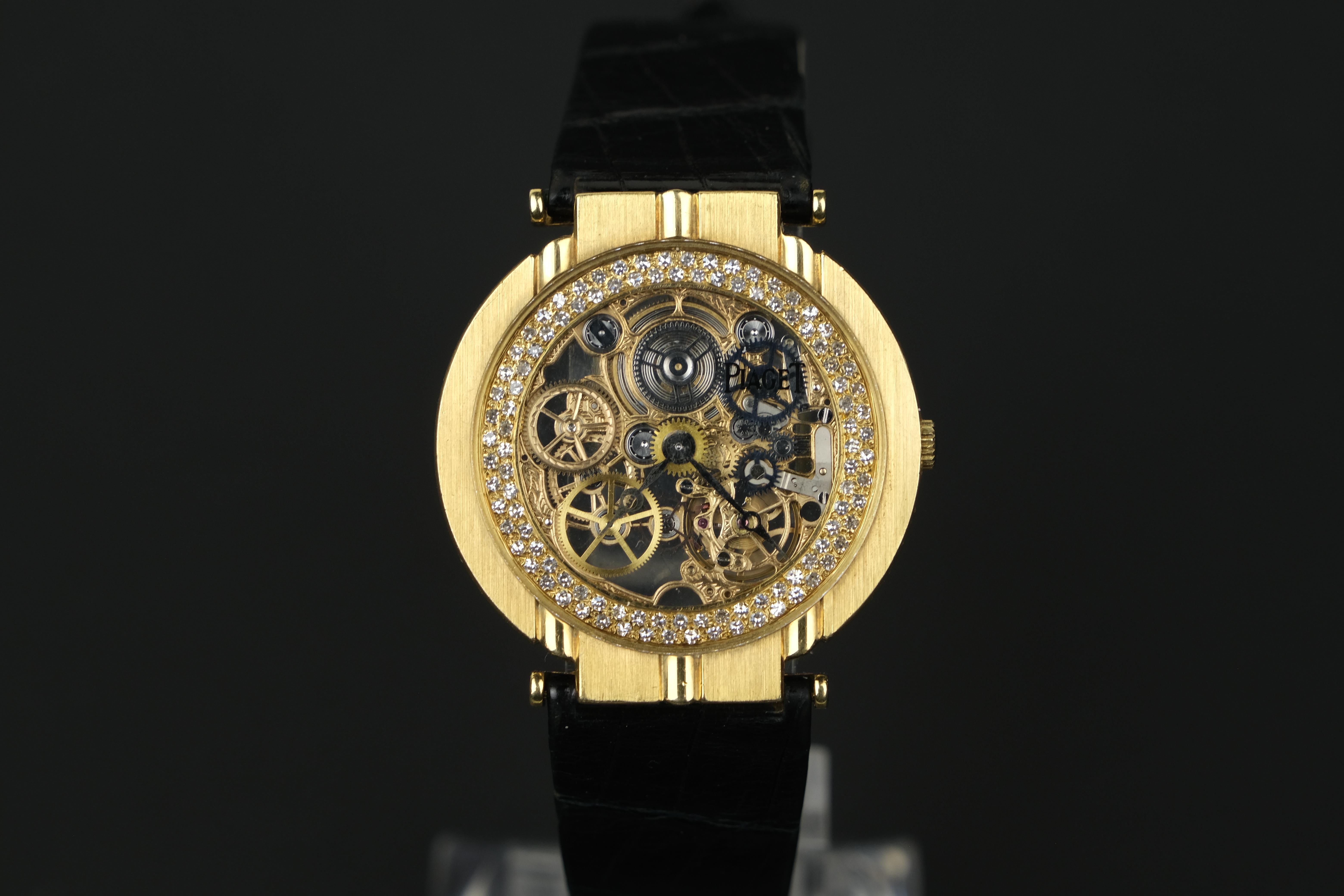 Vintage Piaget Polo Skeleton 18K Gold Diamond Stem Wind Wristwatch

Ultra-thin skeletonized movement with engraved bridges and wheels in an 18K yellow gold case with diamonds accentuated edge of the dial. 
Signed Piaget leather and 18K buckle