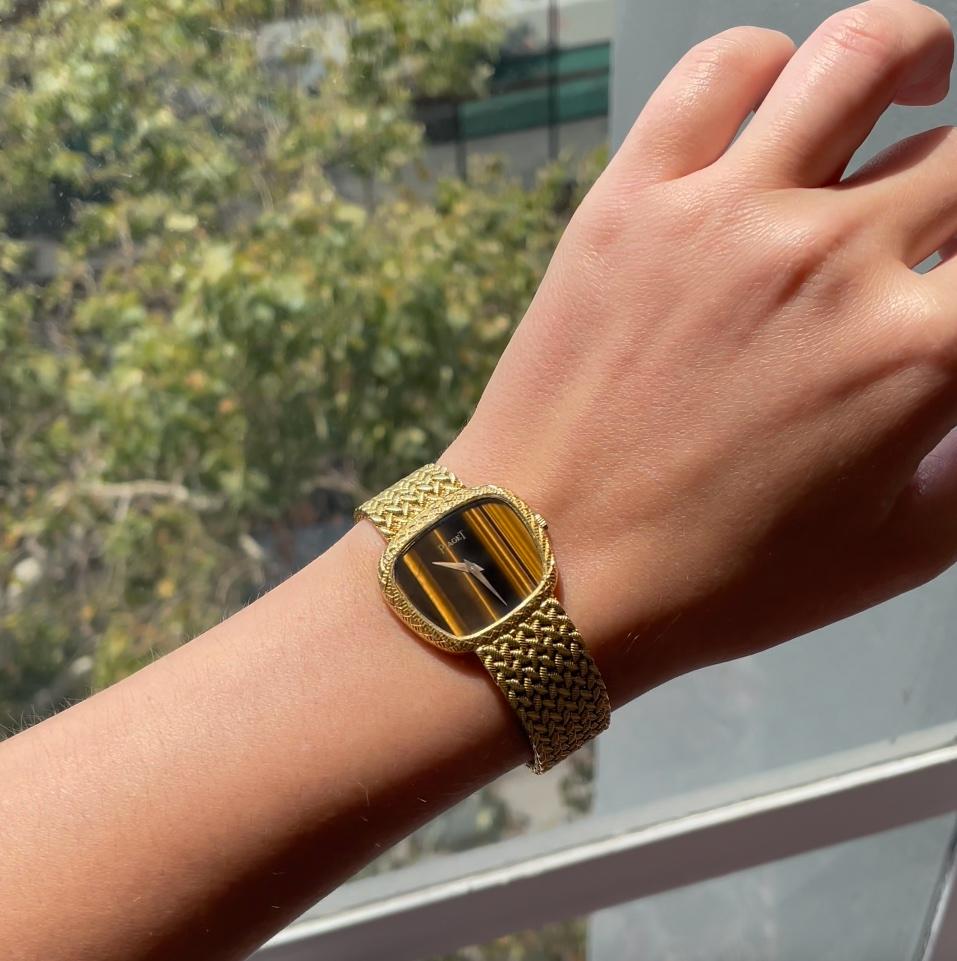 Vintage Piaget Tiger's Eye Watch. Signed Piaget, #196535, with purity marks. Circa 1970s. 6 1/2 inches.

About The Piece: You'll enjoy telling time the old fashioned way. Seeing this spectacular Piaget watch on your wrist will not only brighten your