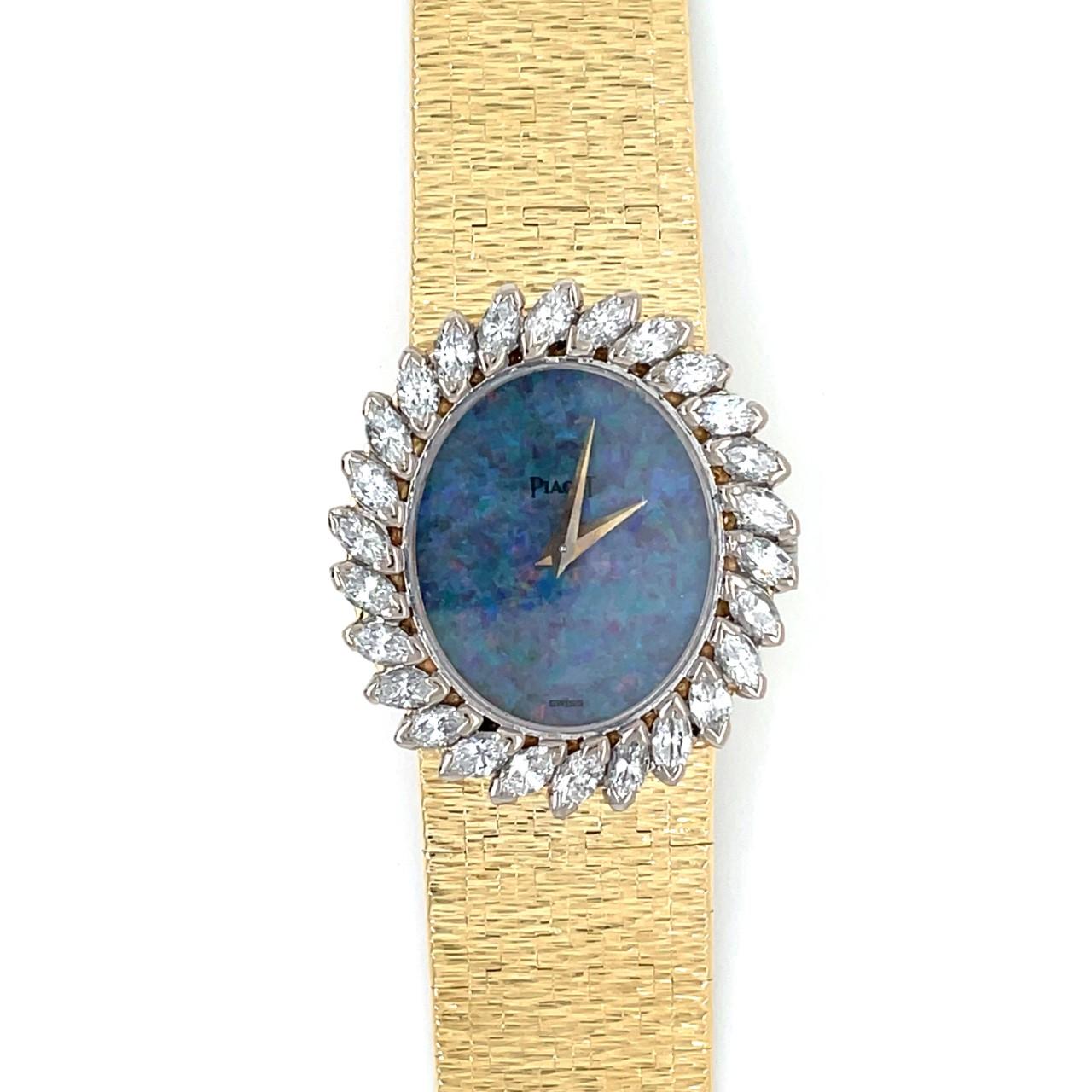 Vintage Piaget Wrist Watch
18k Yellow Gold
Black Opal Dial
Approx. 2.86ct Marquise Diamond Bezel
Reference 9342
1970's
26mm x 30mm