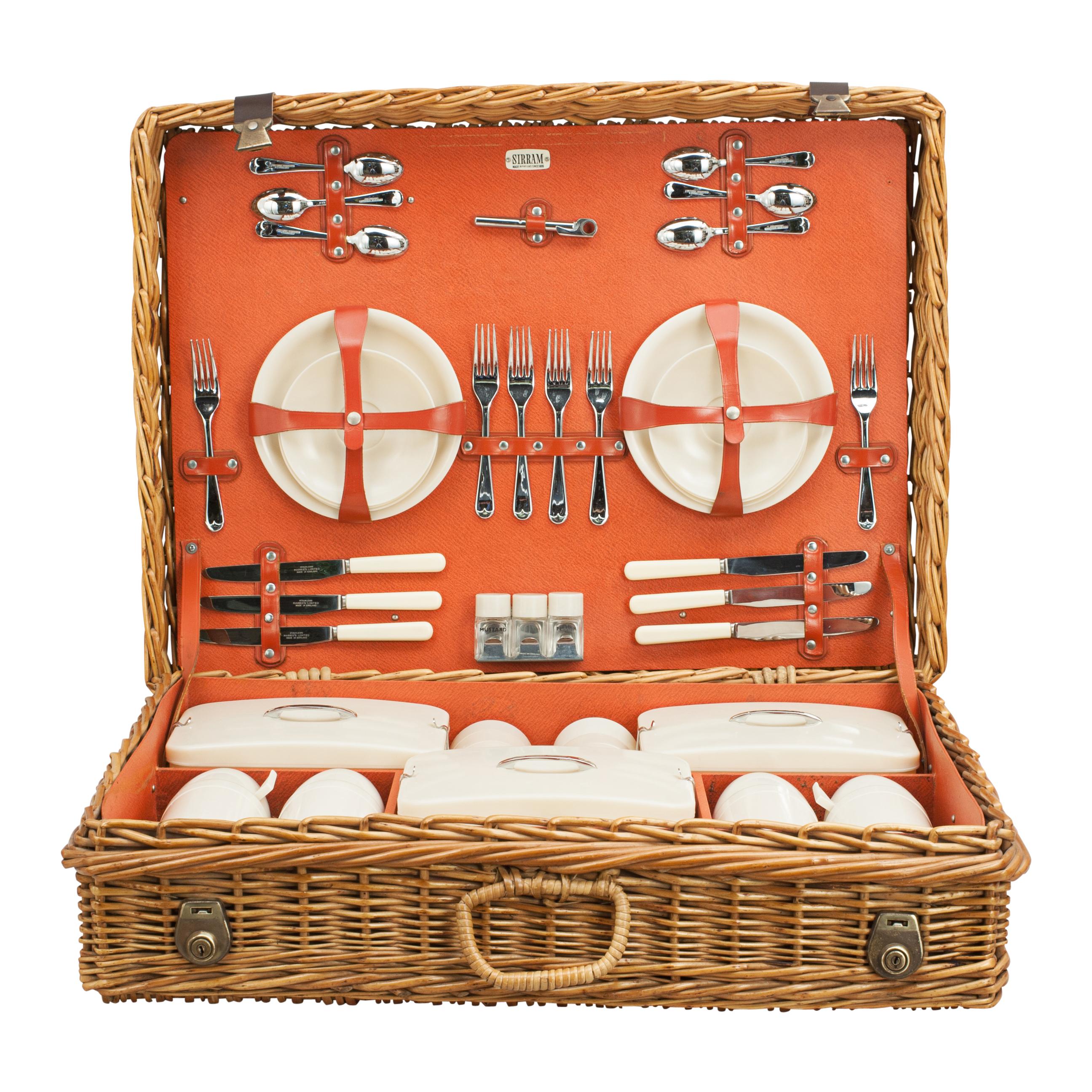 Vintage 'Sirram' picnic set.
A wonderful 'Sirram' six-person picnic set in a neat wicker basket. The case is with two brass locks and catches on leather straps and a single wicker carry handle. The contents are held in place by an internal