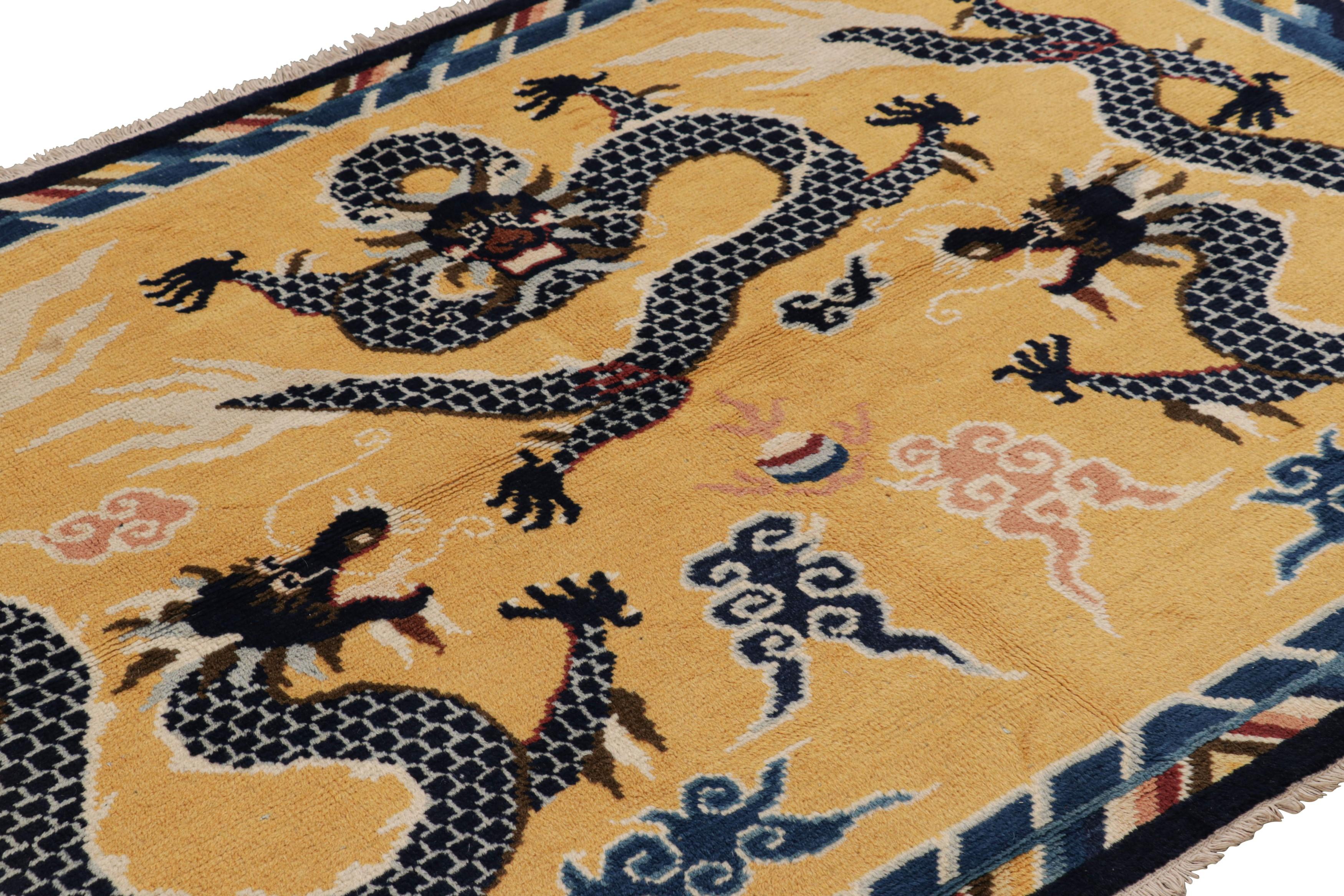 Made with hand-knotted wool in China circa 1960-1970, this 5x7 vintage dragon rug is from a rare and exciting new curation of pictorials in Rug & Kilim’s classics.

On the Design: 

A soft gold field underscores a field of three dragons, all