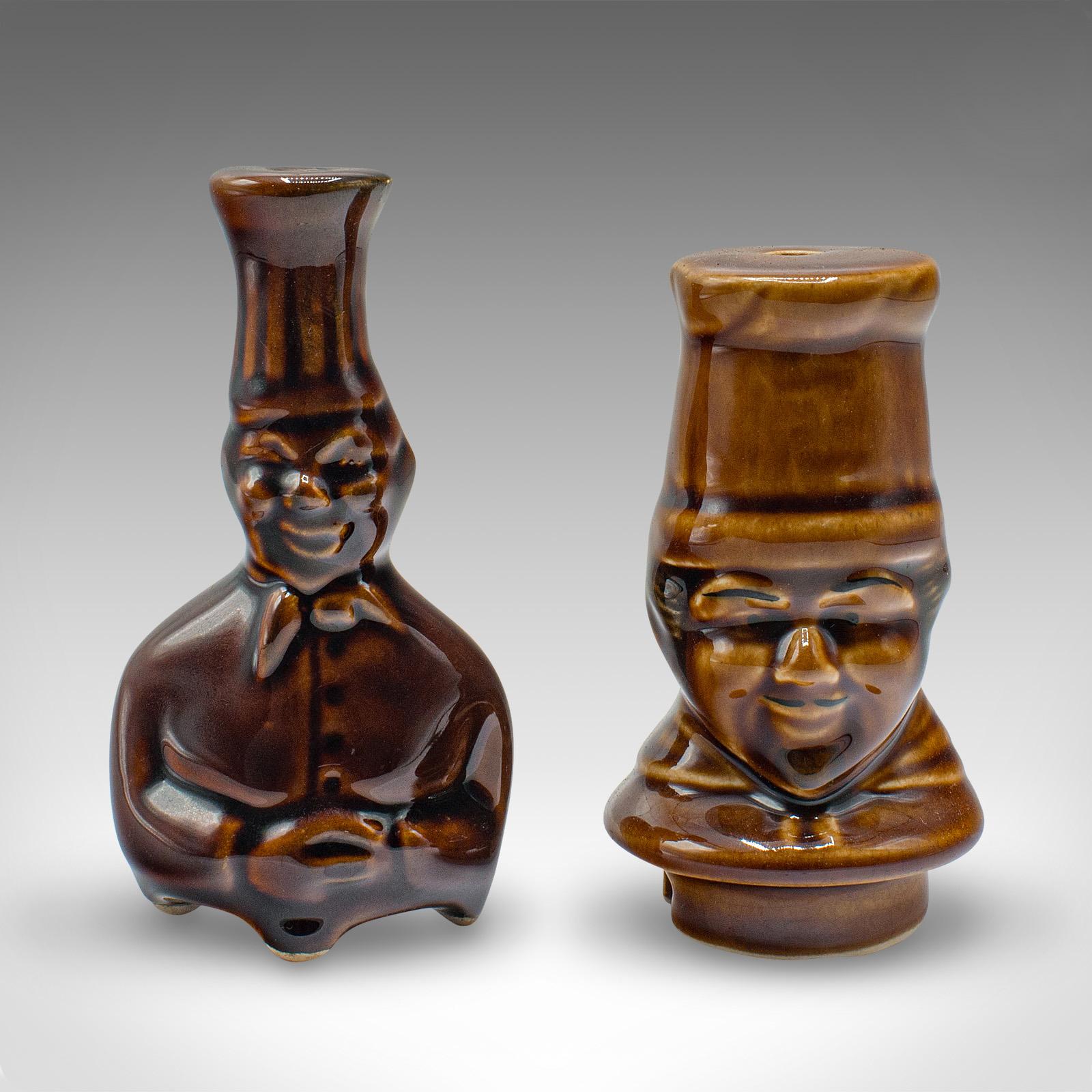 
This is a vintage pie funnel duo. An English, ceramic figural baking chimney, dating to the late 20th century, circa 1970.

Charming chef motif to this duo of chimneys
Displaying a desirable aged patina and in good order
Ceramic finished in shades