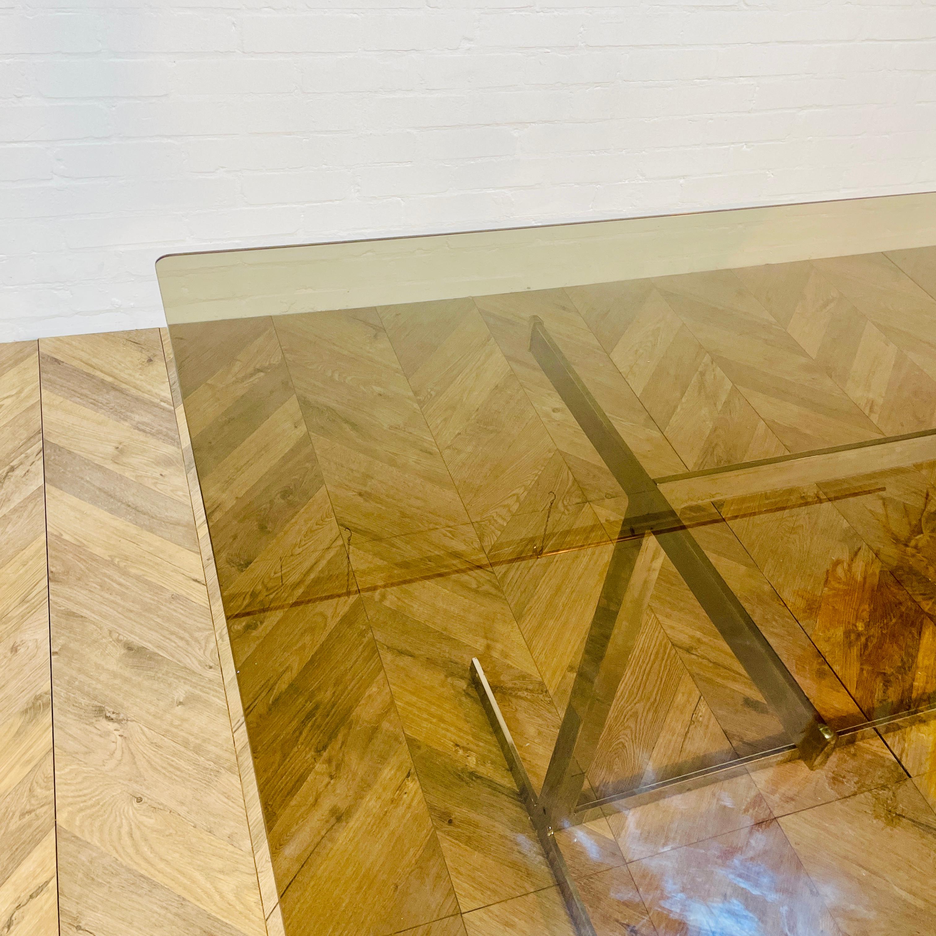 A Stylish Mid Century, Modernist Smoked Glass And Chrome Dining Table, comfortably seats 6.

Designed by Tim Bates for English manufacturer Pieff of Worcester, with toughened smoked glass top, raised on a polished chrome metal frame in the Bauhaus