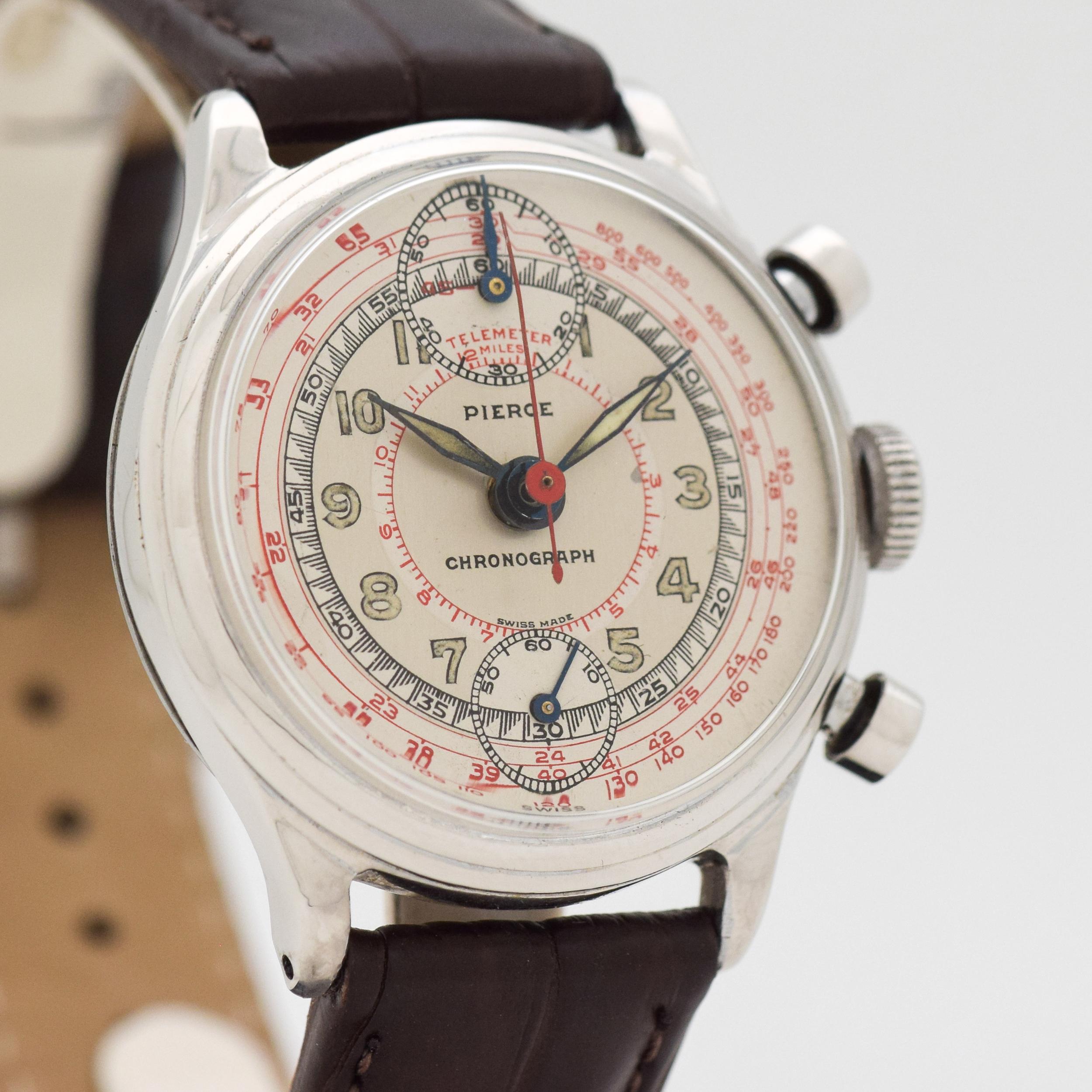 1950's Vintage One Button 2 Register Chronograph Nickle/Chrome & Stainless Steel Case Back watch with Two Tone Gray and Silver Dial with Luminous Arabic Numbers and Red Outer Tachometer Track. 33mm x 38mm lug to lug (1.3 in. x 1.5 in.) - Powered by