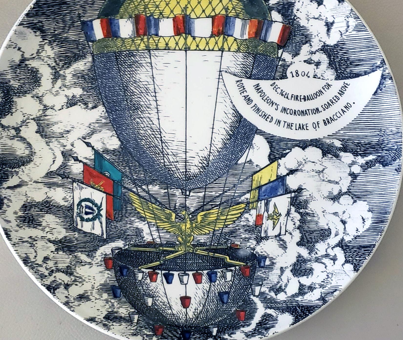 Vintage Piero Fornasetti Plate,
Mongolfiere (hot air) Design,
1804/ Dec. 16 fire-balloon for/Napoleon's Incoronation, soared above/ Rome and Finish up in the Lake of Bracciano.
1950s
  

The large Piero Fornasetti plate depicts a large hot air