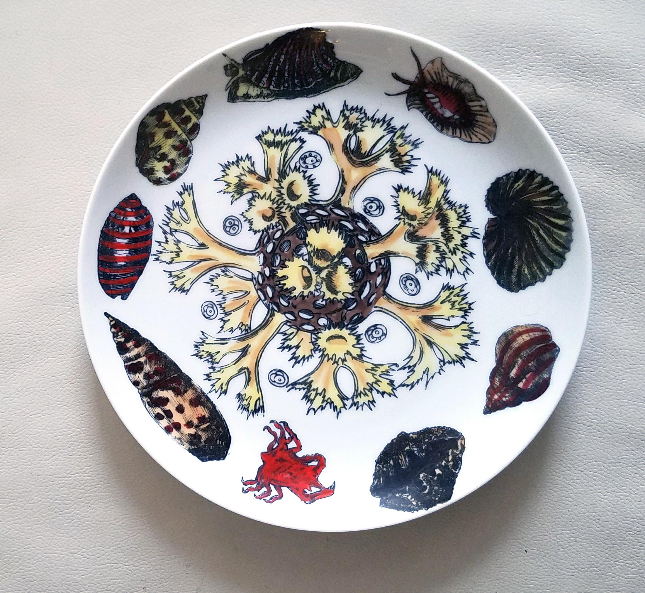 Pair of Vintage Piero Fornasetti Porcelain Plates,
decorated with sea anemones, urchins and shells,
#7 & #12 from Conchiglie Pattern,
Circa 1960-1970s.

The Fornasetti plates are decorated in the Conchiglie pattern which depicts different seashells
