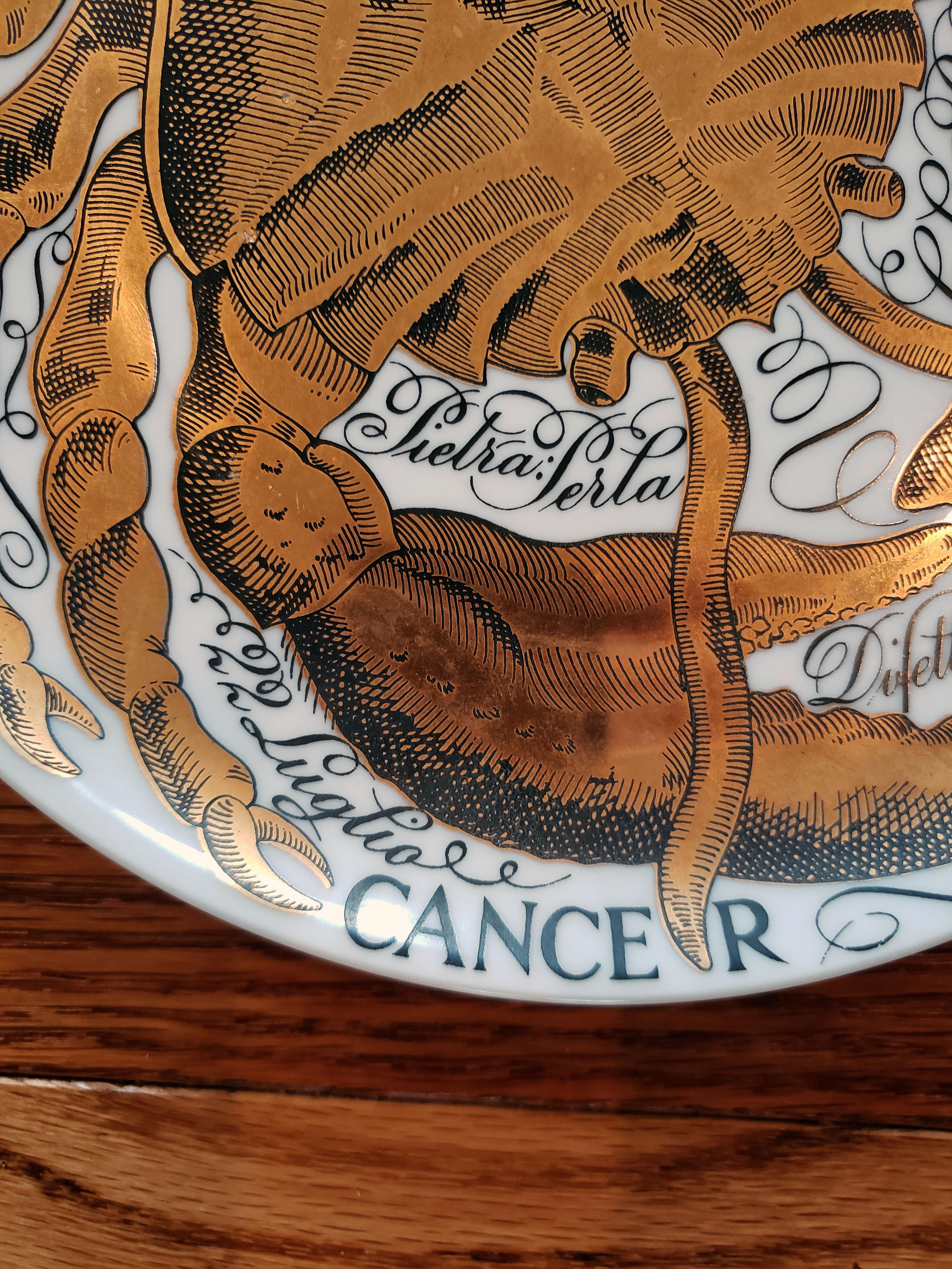 Vintage Piero Fornasetti Porcelain zodiac plate,
Cancer,
Astrali Pattern,
Made for Corisia,
Dated 1974, No 11.

The plate for the sign CANCER is dated 1974 and is numbered #11. The plate depicts the Astrological Zodiac sign Cancer which is