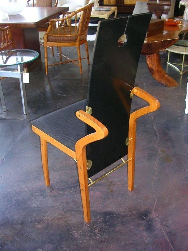A single chair designed by Pierre Cardin made in 1983. The back is black lacquered with brass hardware. Outstanding detail with the wing shaped back supports.
Dimensions:
42.5