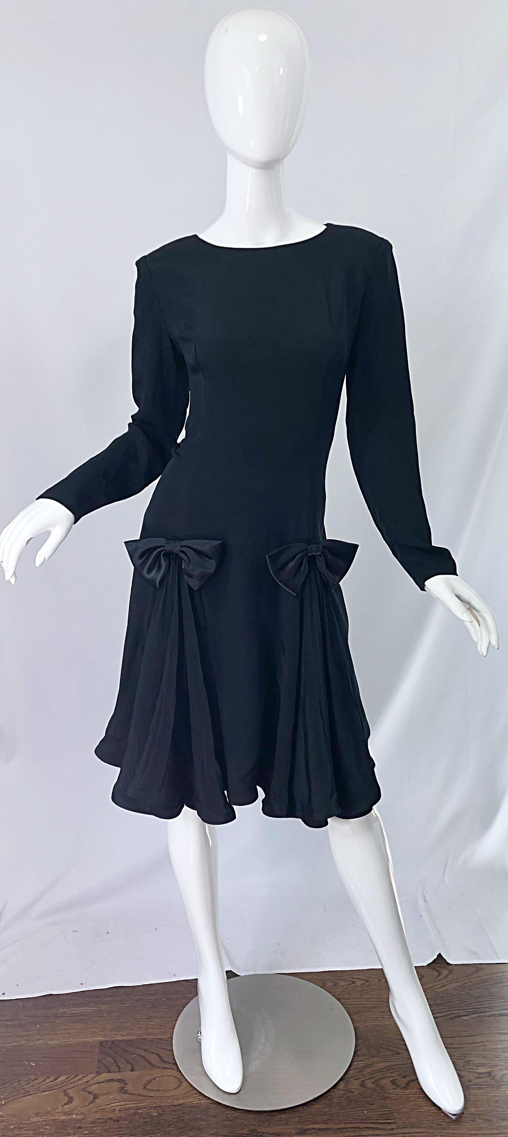 Timeless vintage early 90s PIERRE CARDIN black silk long sleeve bow dress ! Features a tailored bodice with a forgiving full pleated skirt. Hidden zipper up the back with hook-and-eye closure. The perfect little black dress that is great for any