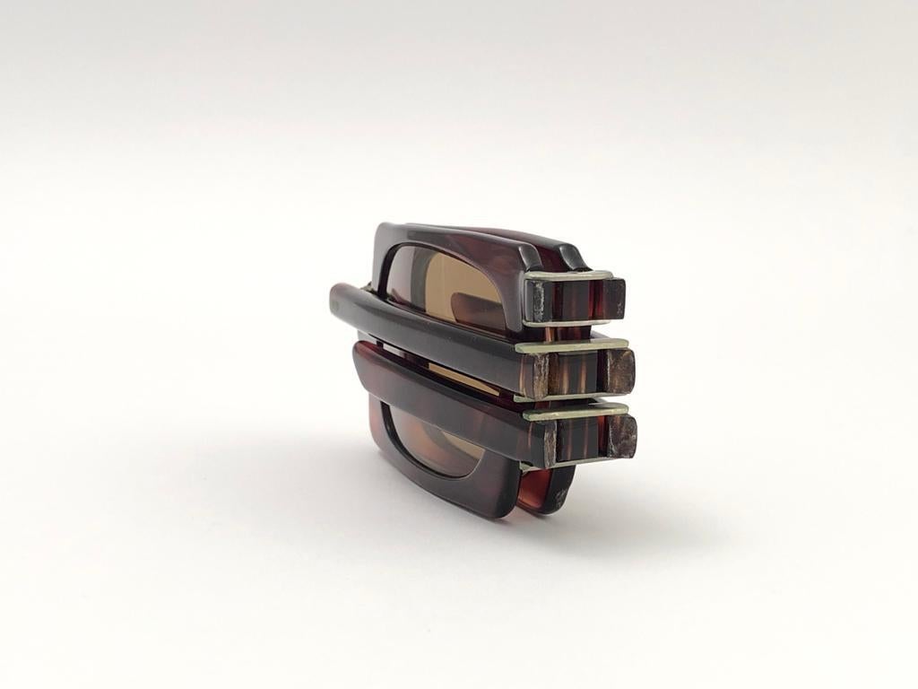 Vintage Pierre Cardin Tortoise foldable frame with amber lenses. 

This seldom piece has sign of wear on them due to nearly 60 years of storage.

This pair of vintage Pierre Cardin is a unique piece rarely seen up for sale, a sunglasses museum