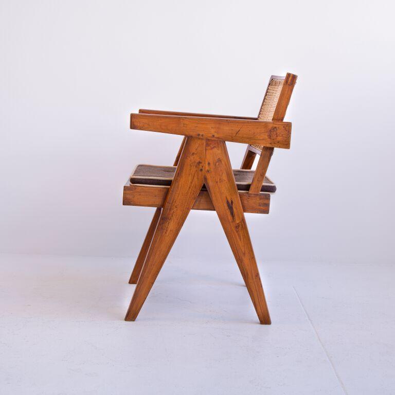 Iconic teak and cane office armchair by Pierre Jeanneret from the administrative offices of Chandigarh, India. The inverted 