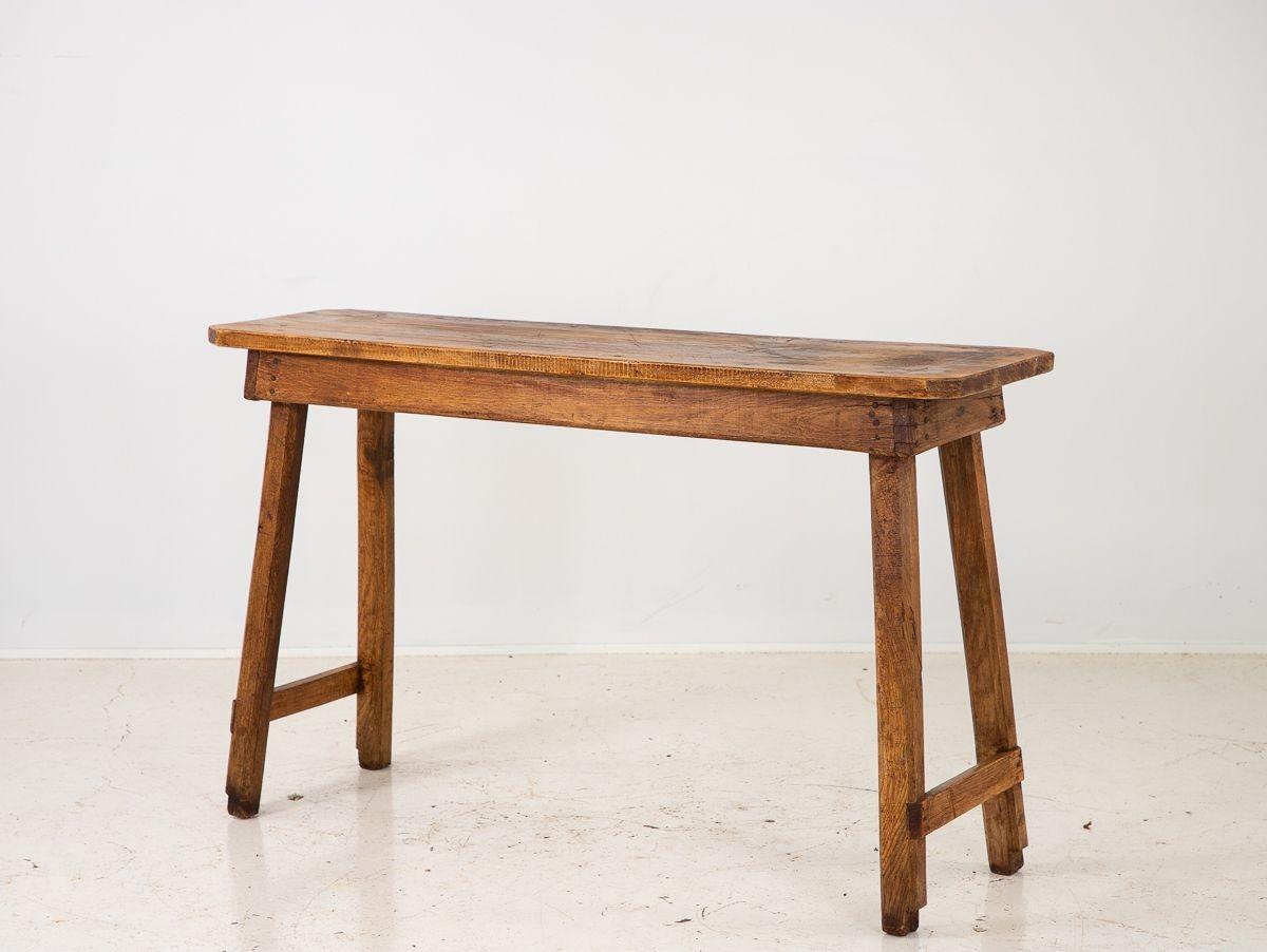 A vintage rustic console or table in the style of a pig bench. England, 1920s.