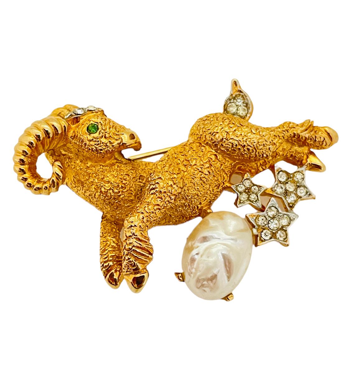 DETAILS

• signed PIM

• gold tone with rhinestones and pearl 

• vintage designer runway brooch

MEASUREMENTS

• 2