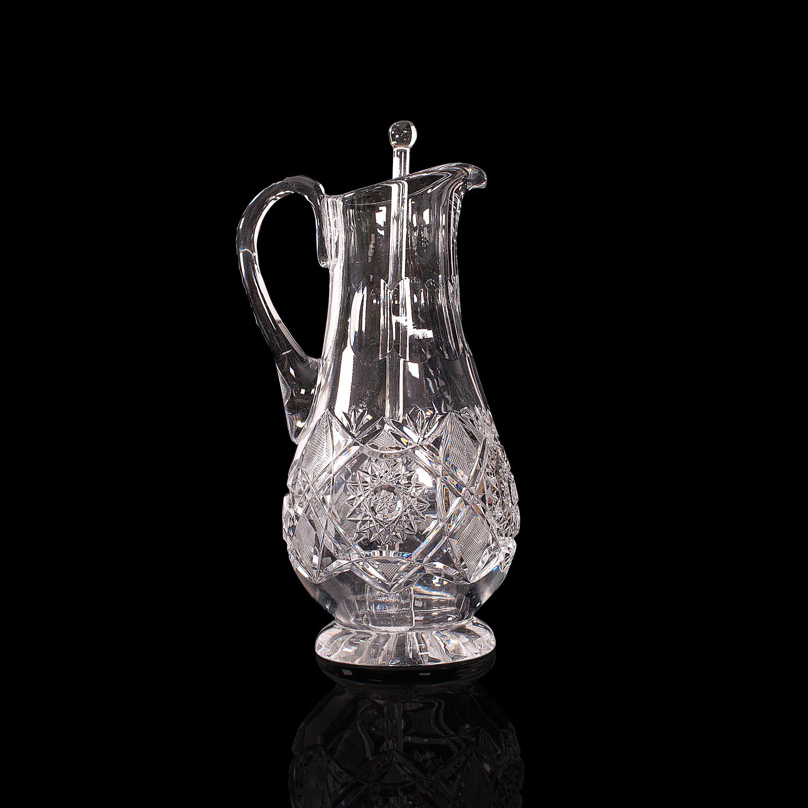 This is a vintage Pimms jug. An English, glass punch serving ewer, dating to the mid 20th century, circa 1950.

Pour in style with this attractive decorative jug and glass stirrer
Displays a desirable aged patina and in good order