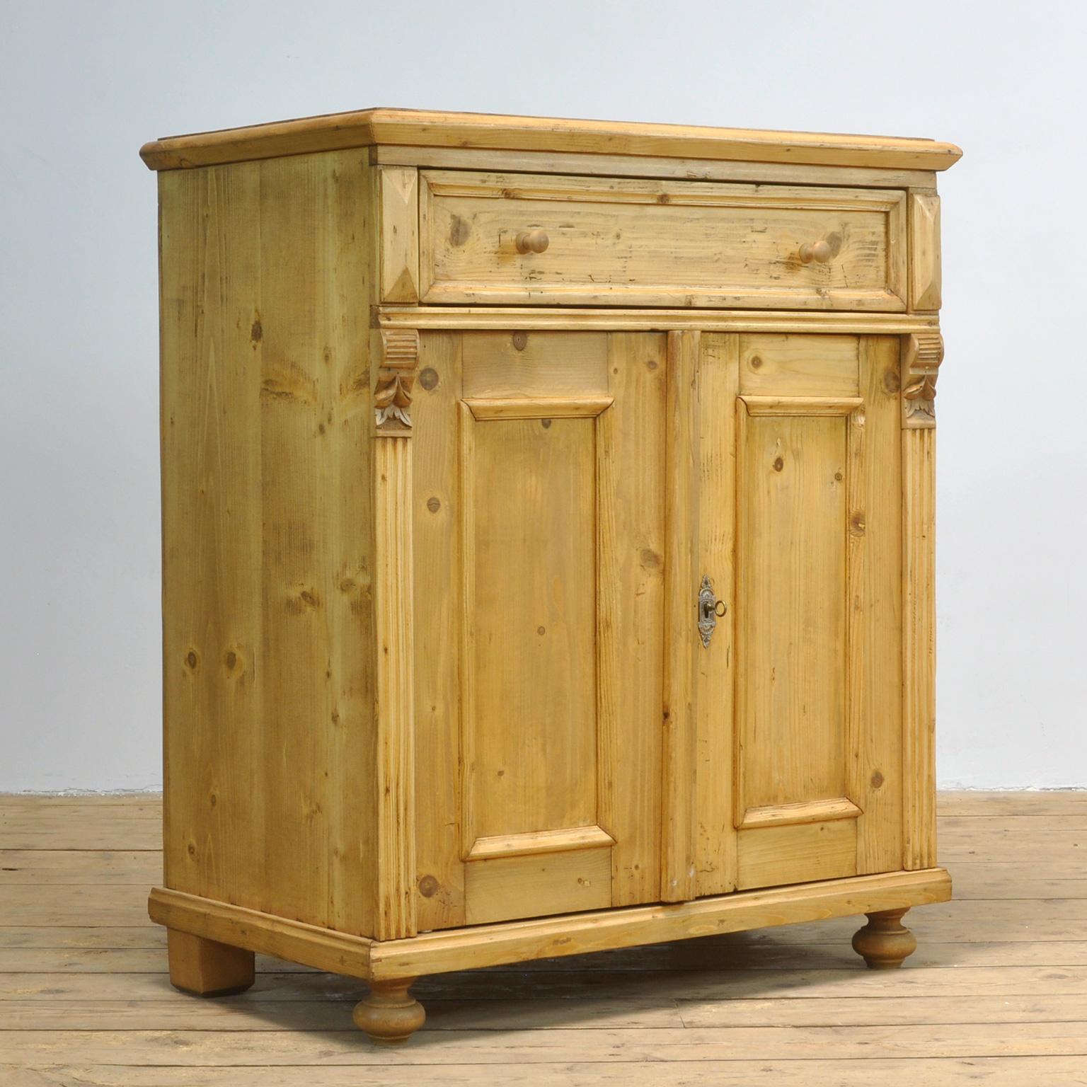 Dresser made of pine. Produced in the 1930s with a drawer and a shelf inside.