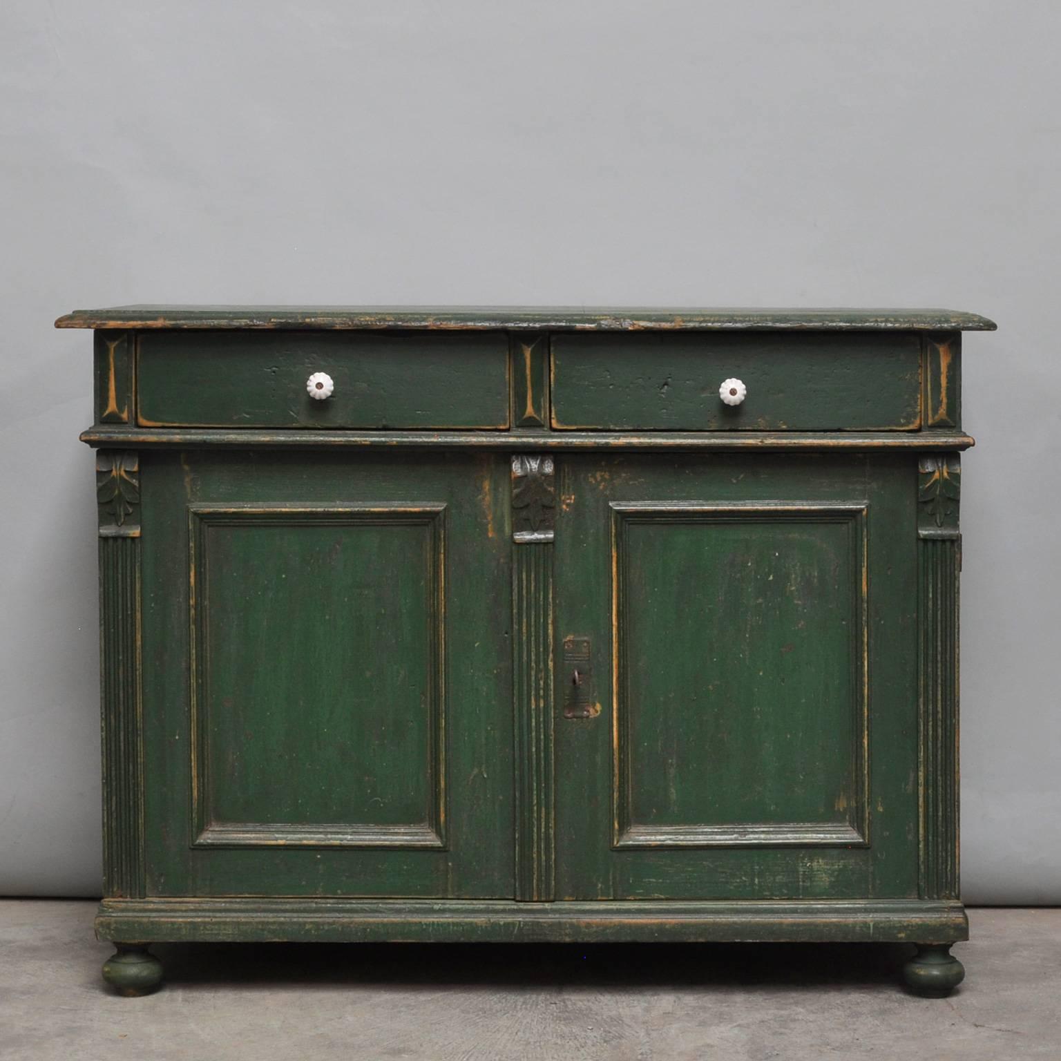 Dresser made of pine. Produced in the 1930s with two drawers and a shelf. Original paint.
