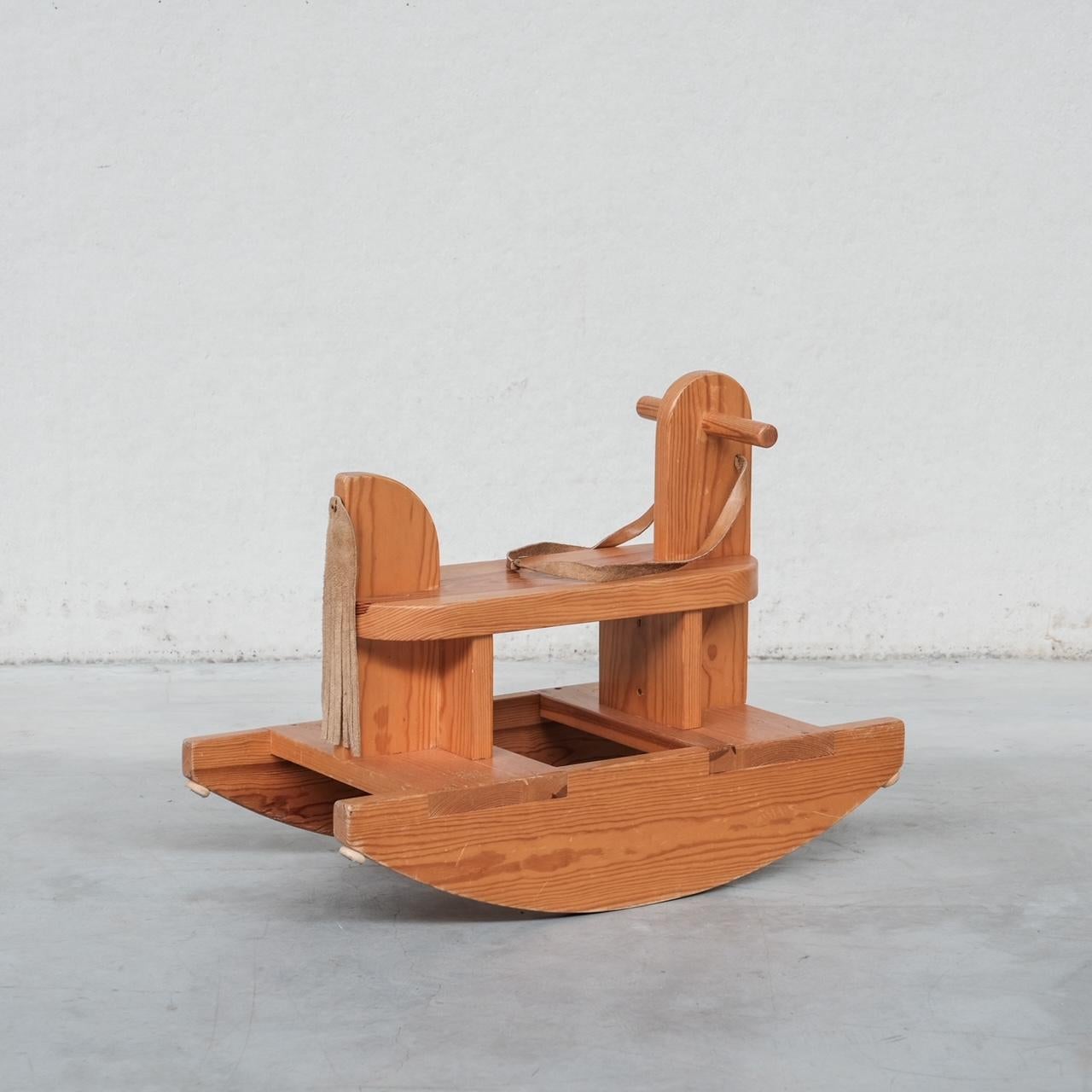A rare original mid-century rocking horse.

Leather handle and 'tail'.

Denmark, c1970s.

Good vintage condition.

Ideal as a final touch to a child's room.

Internal Ref: 07/03/24/015.

Location: Belgium Gallery.

Dimensions: 75 W x 38 D x 58 H in