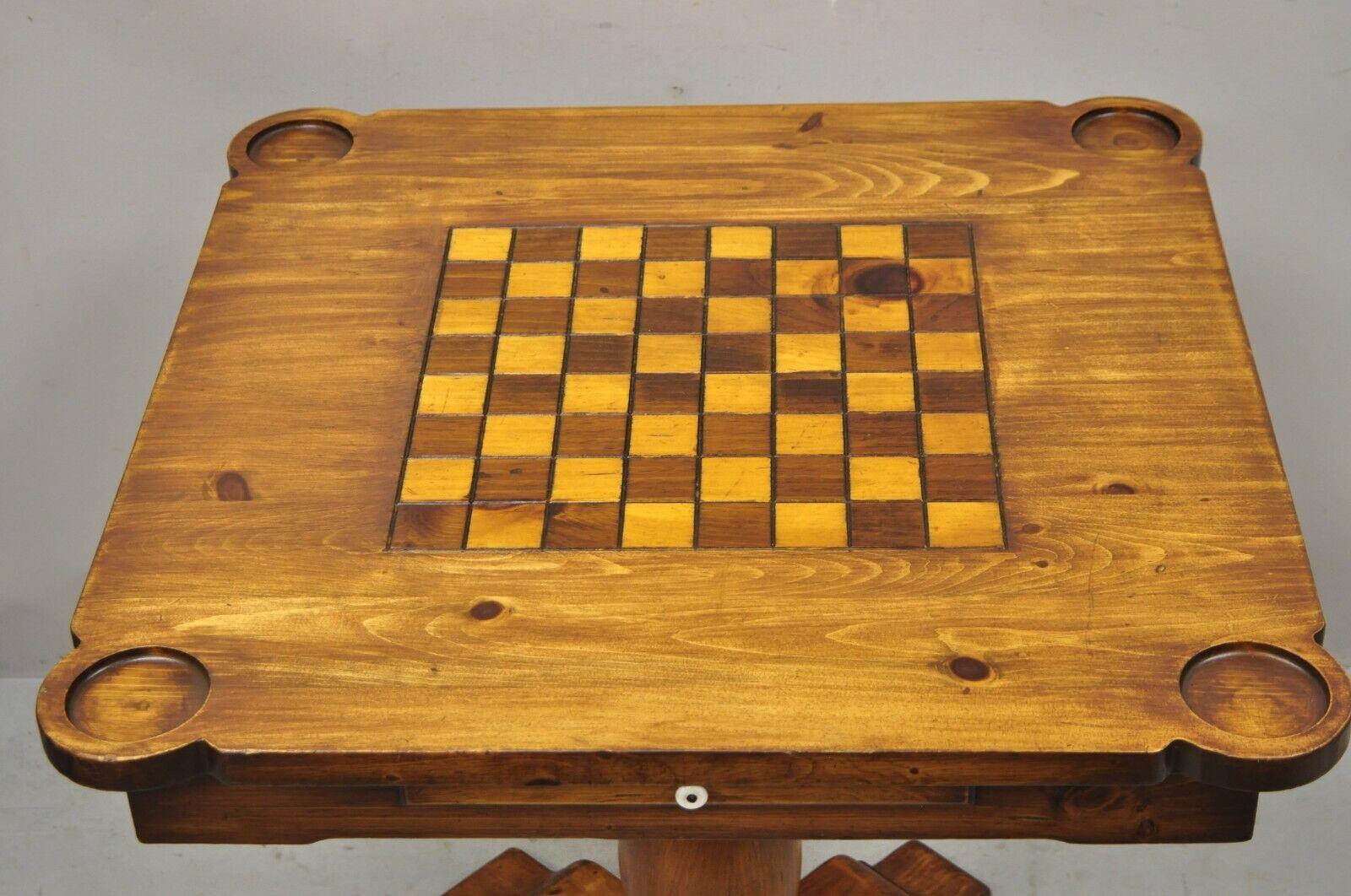 Vintage Pine Wood Colonial Style Pedestal Base Game Table with Drawer. Item features carved pedestal base, 4 cupholders, carved game table top, solid wood construction, beautiful wood grain, 1 dovetailed drawer, very nice vintage item, great style
