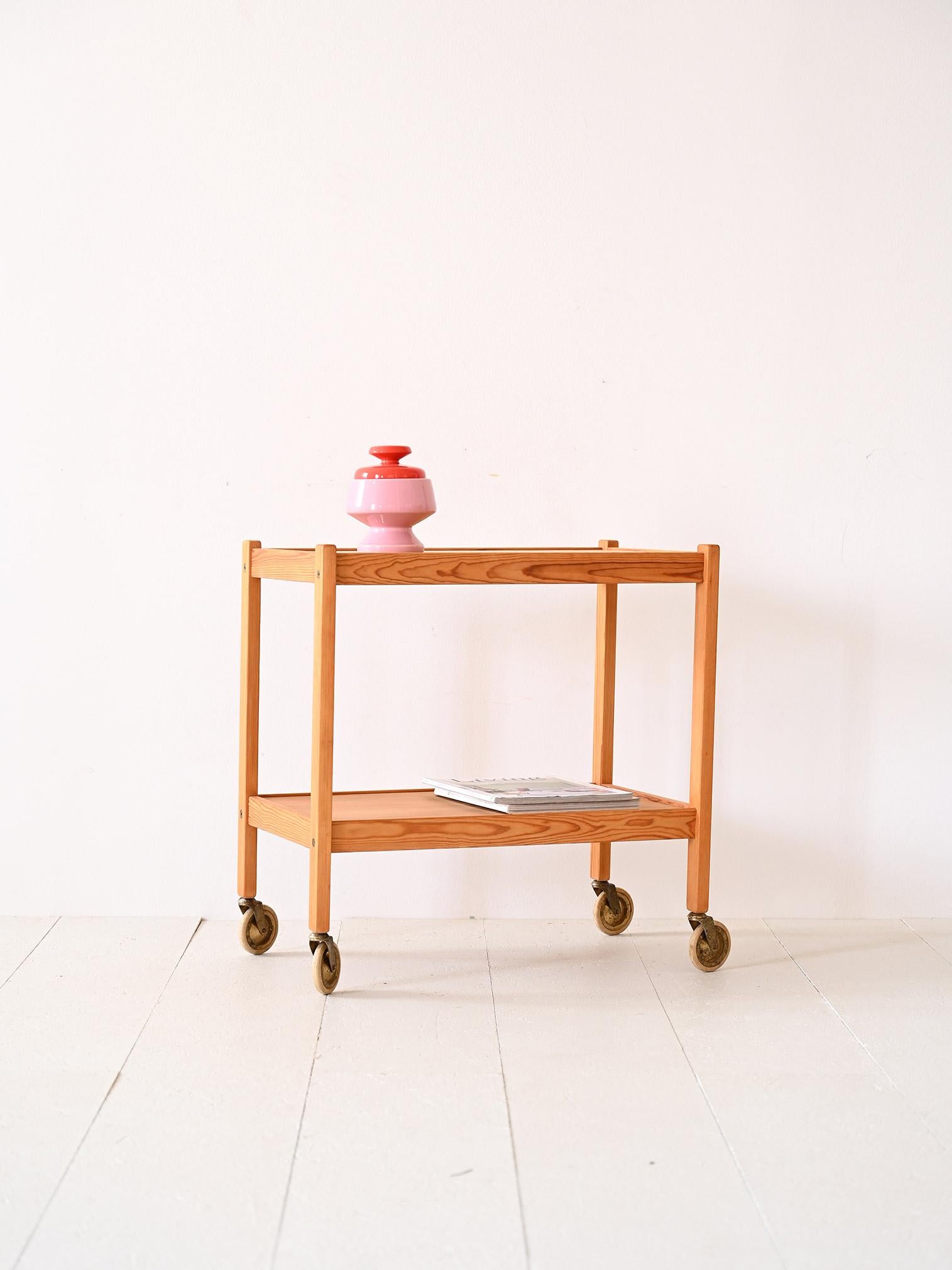 Scandinavian side table with wheels.

A trolley with minimal lines and modern taste that can also be used as a coffee table for the living room. The presence of the two tabletops and wheels makes it a practical and functional piece. 
The