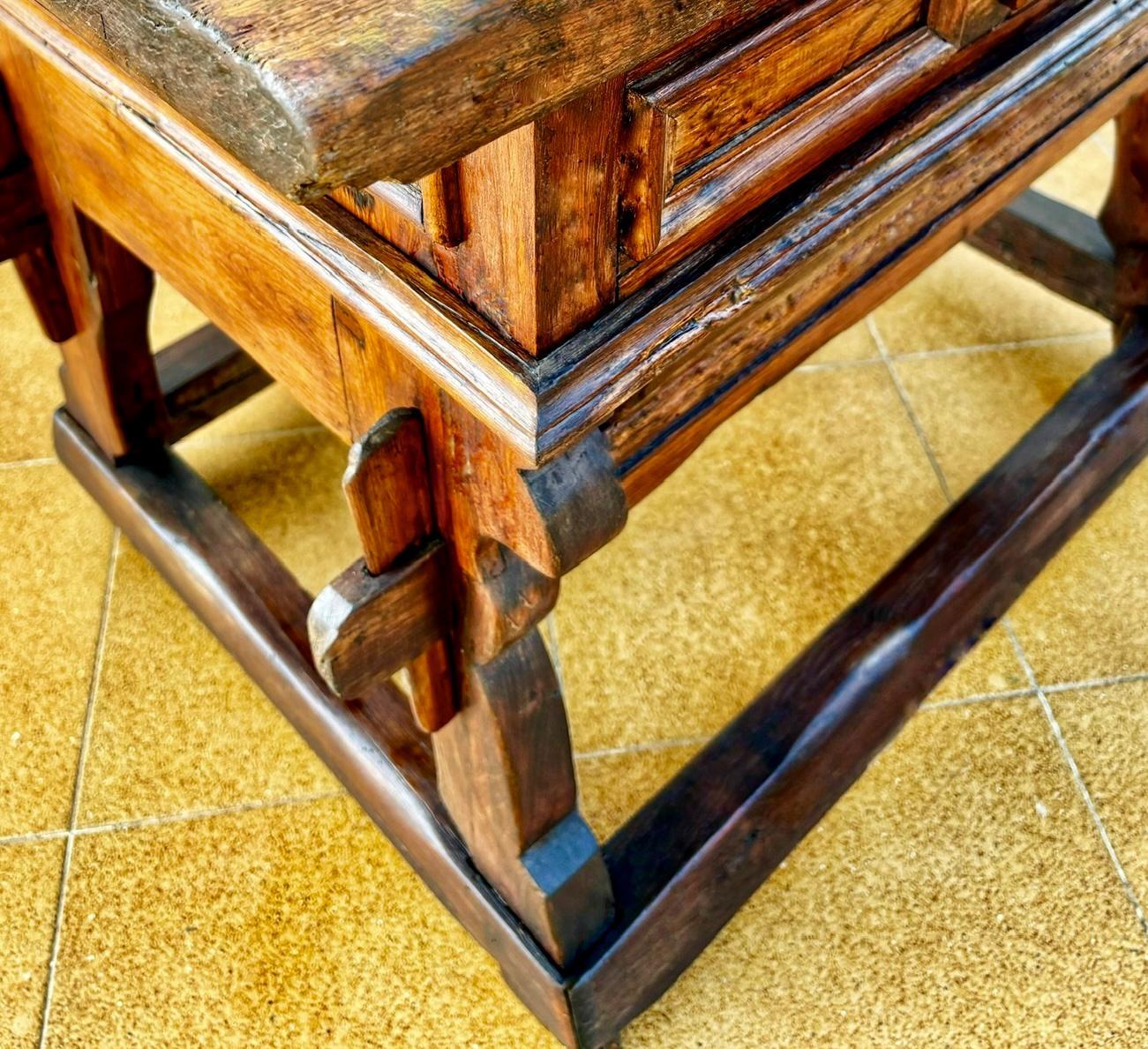 Beautiful work table or auxiliary furniture from the early 20th century, made of mobila (pine) wood. You can see signs and aging of the wood due to its use and age.