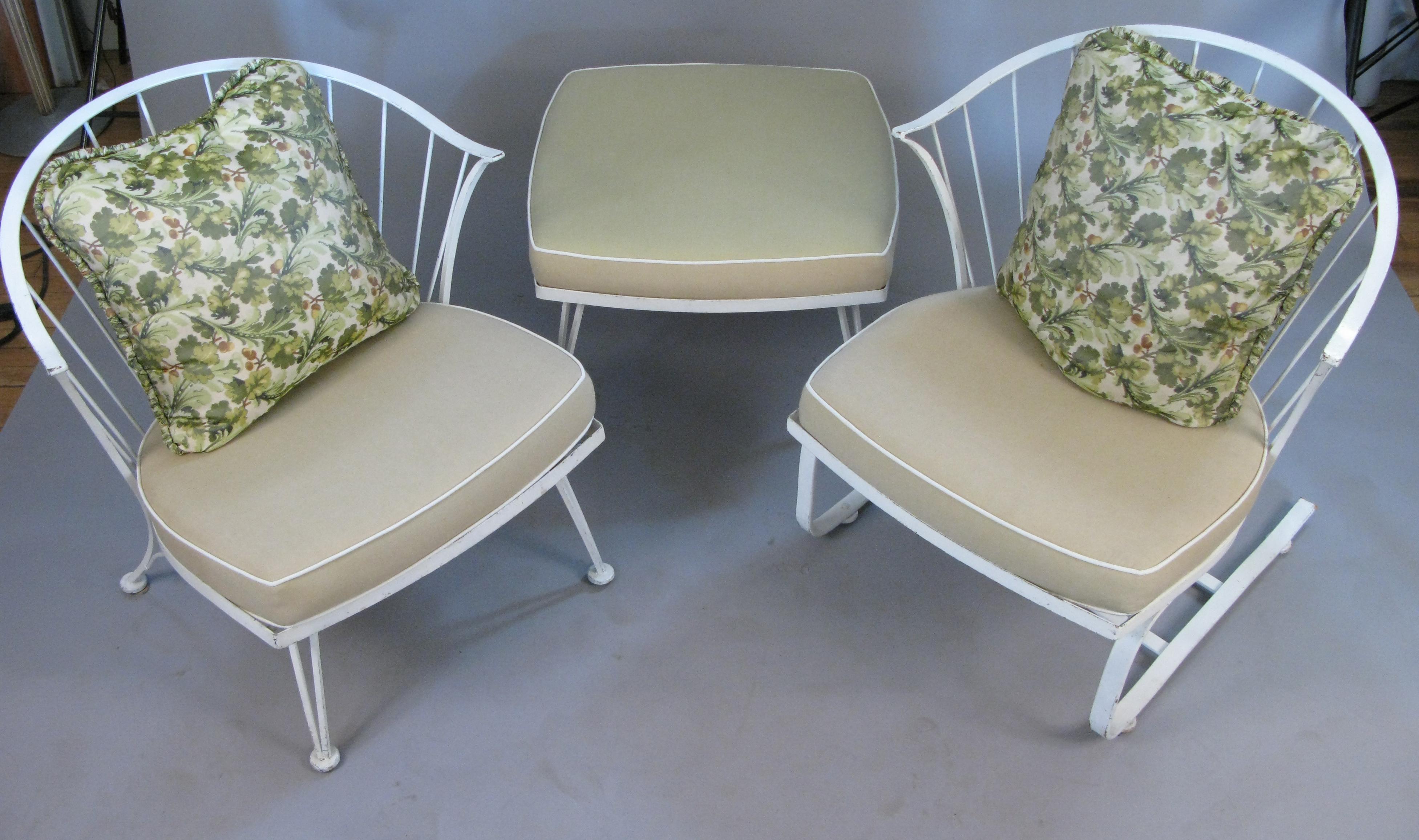 A very nice set of vintage lounge seating from Woodard's Pinecrest collection, circa 1960. set includes a large lounge chair, and a matching large lounge chair on a spring base, along with the matching ottoman. in their original white finish, which