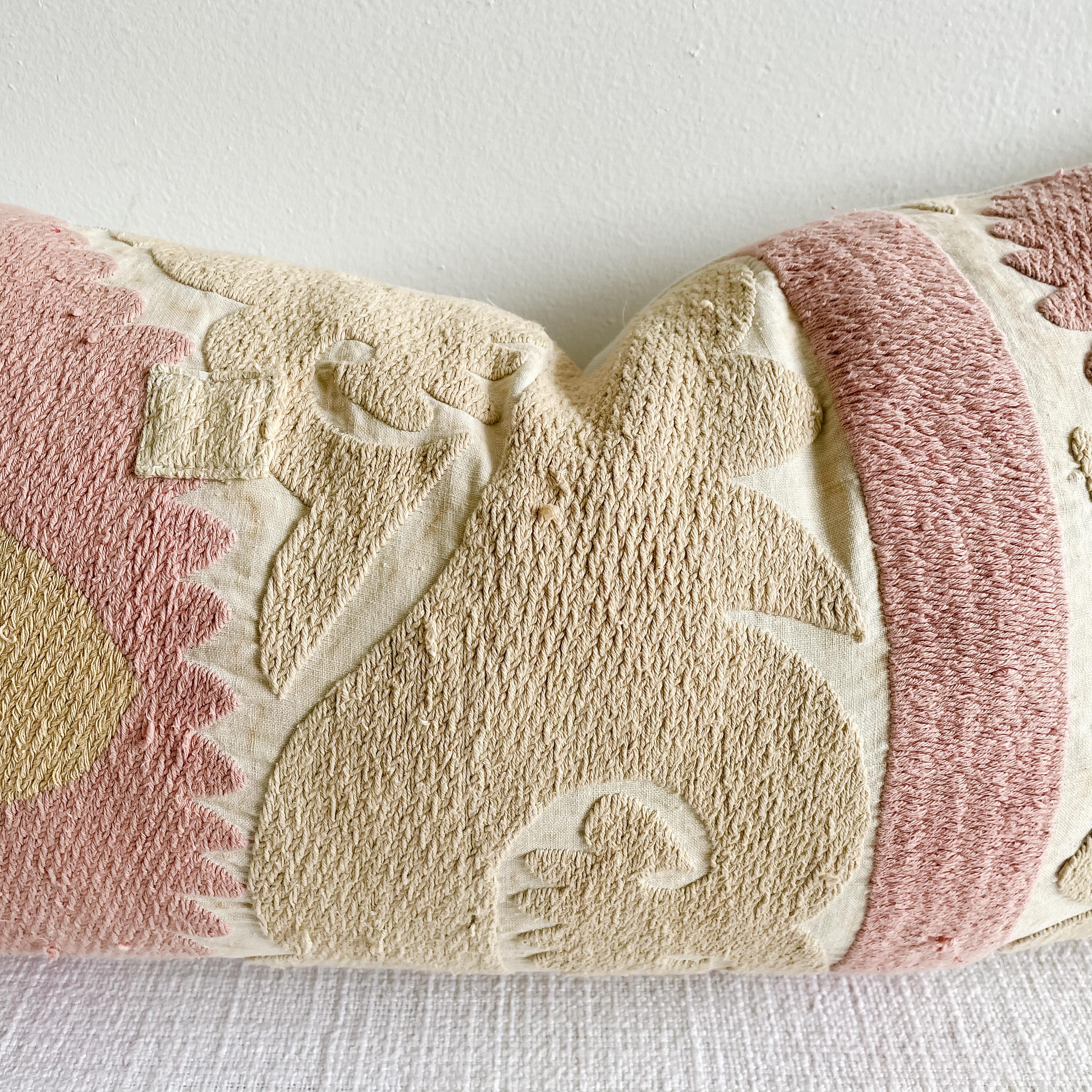 Vintage pale pink and tan embroidered Suzani on a natural muslin background.
This vintage textile pillow face features a vintage Suzann quilt, natural linen colored background with original hand embroidery. The backing is 100% Belgian linen in