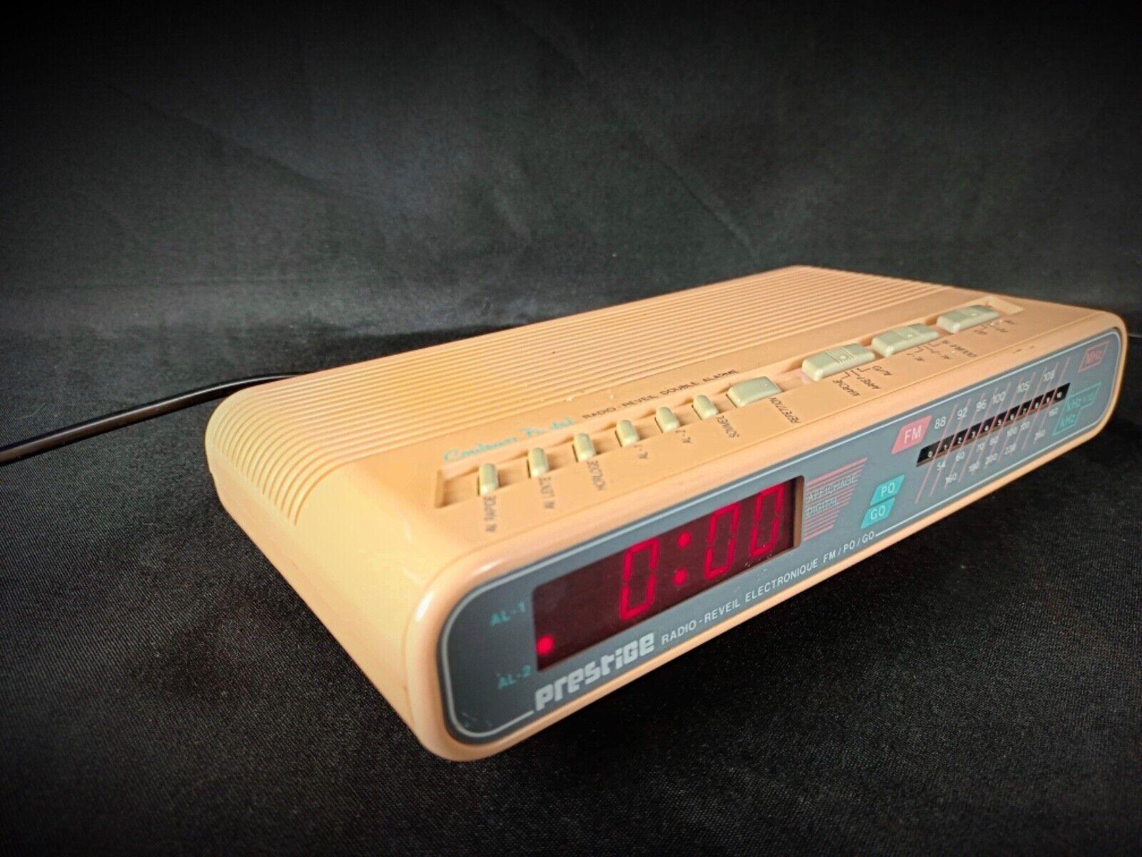 Add a touch of retro charm to your space with this vintage pink electronic alarm clock radio by Prestige, model No. 736. Designed for both style and functionality, this elegant piece combines classic design with modern convenience, featuring FM, AM,