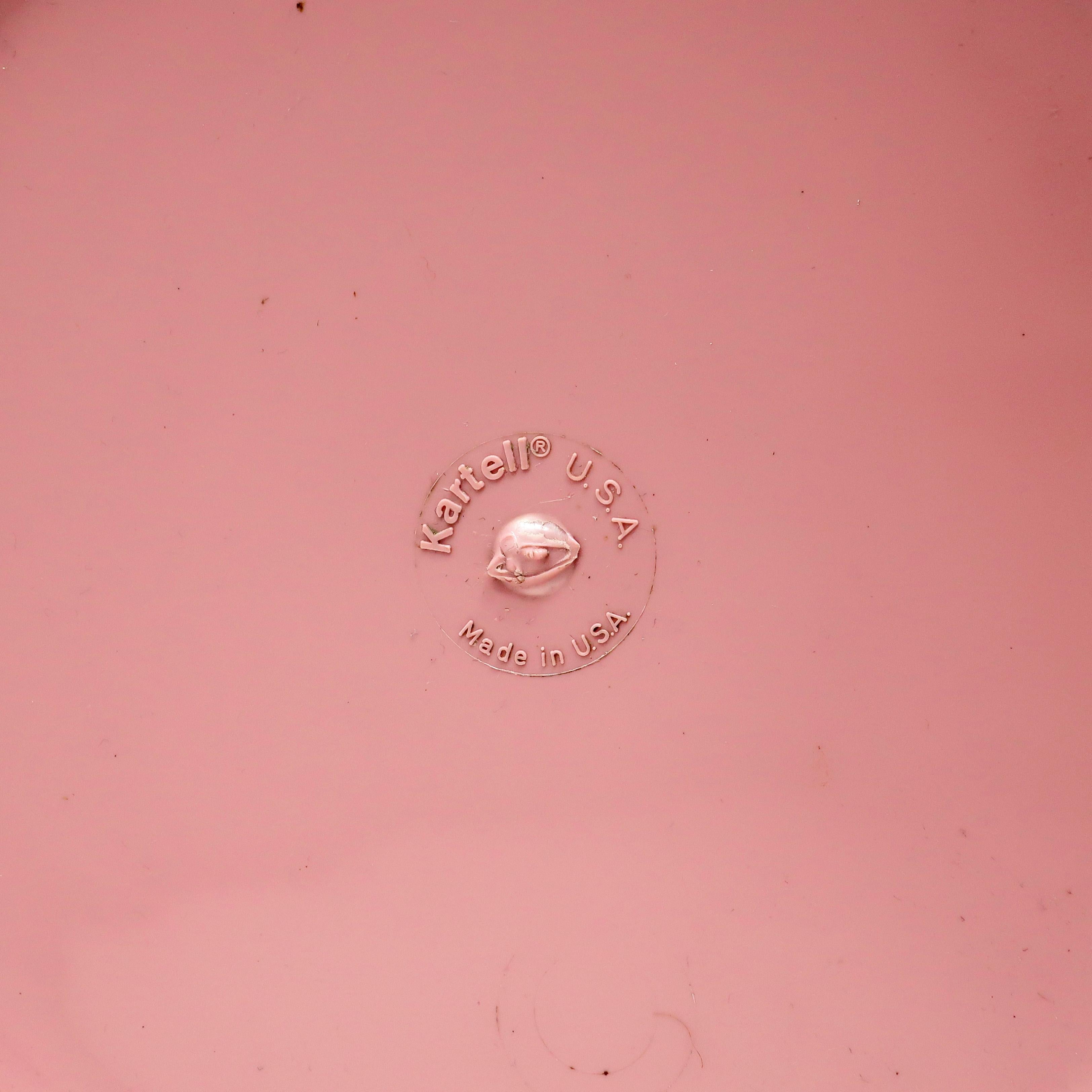 A vintage pink acrylic trash can with a simple cylindrical form by Italian plastics manufacturer Kartell. 

Measures: 9.75