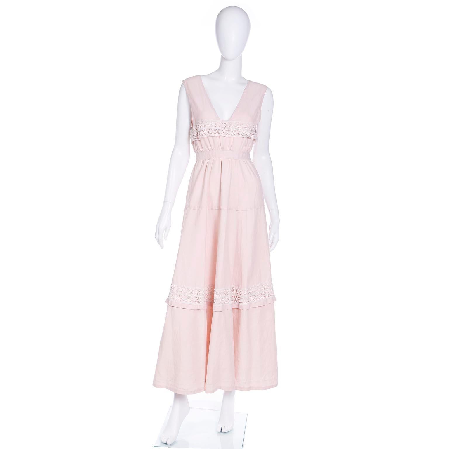 We love the Victorian and Edwardian era lawn dresses and this one is so wearable today! This beautiful medium weight pink linen, or cotton linen blend, full length lawn dress would have originally been worn with a blouse underneath. The dress has