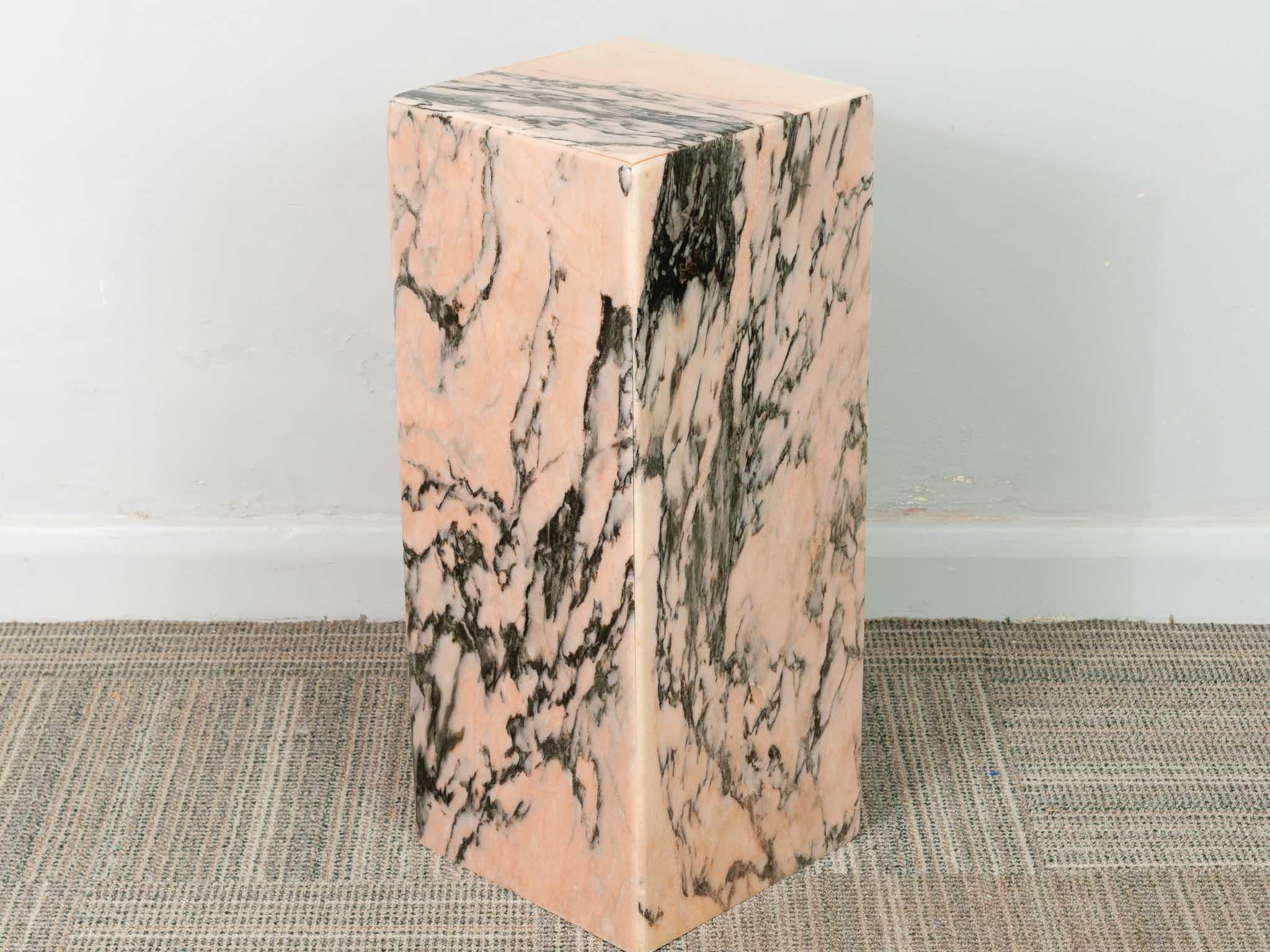 An Italian rectangular pink and black marble display plinth. There are no chips or cracks however there is a scratch worth noting on one side commensurate with its age and past use.

Dimensions: Depth: 250 mm; Width: 250 mm; Height: 600 mm.