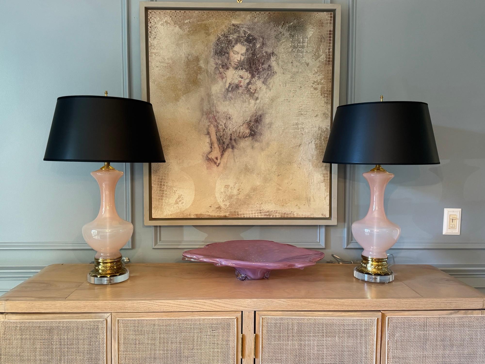 Mesmerizing Vintage Murano lamps in SOFT PINK. Such a beautiful feminine shape! We’ve added a slight update to the beautiful brass base with the addition of 1 inch high lucite!

The lamps stand 23” inches from tabletop to socket top. As shown, the
