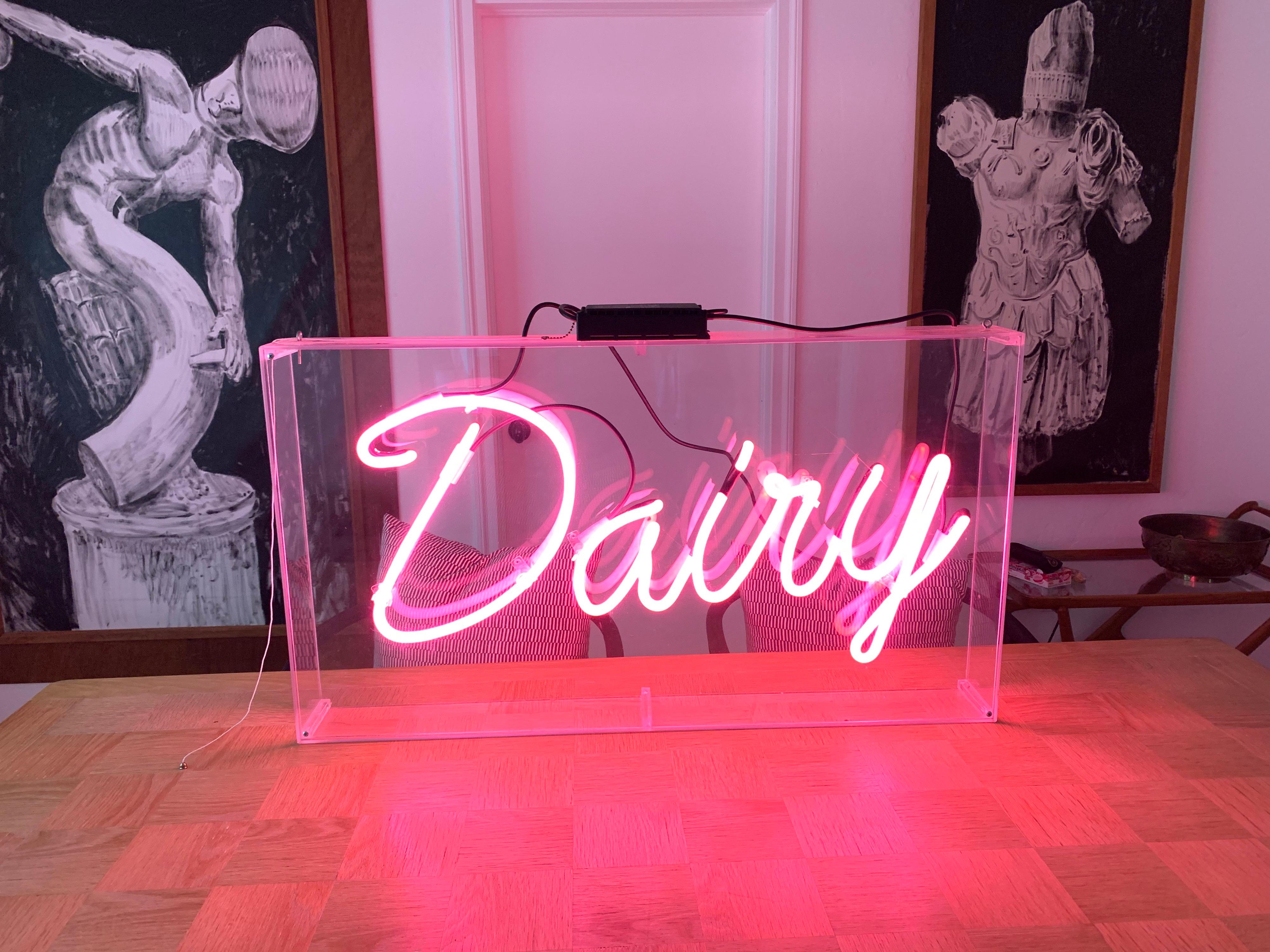 A touch of PINK NEON Pop Art encased beautifully in acrylic box. Pull string to illuminate. ALL original and vintage in perfect working condition. Great for a tabletop or can be hung as well.

Dimensions: 36.5 wide, 20.5 tall, 4 deep.