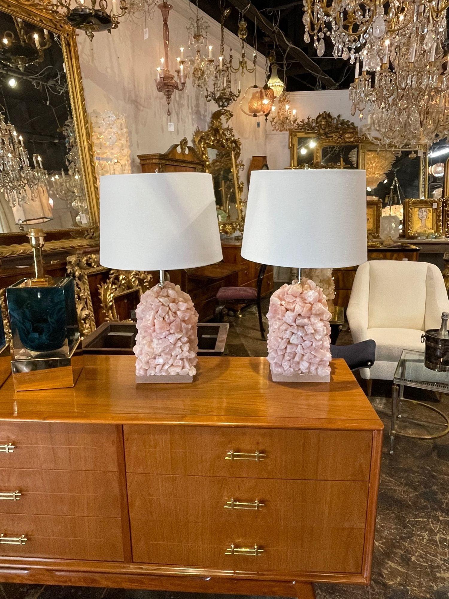 Interesting pair of vintage pink quartz sculptural lamps. These are very fine quality and create an upscale look!.
