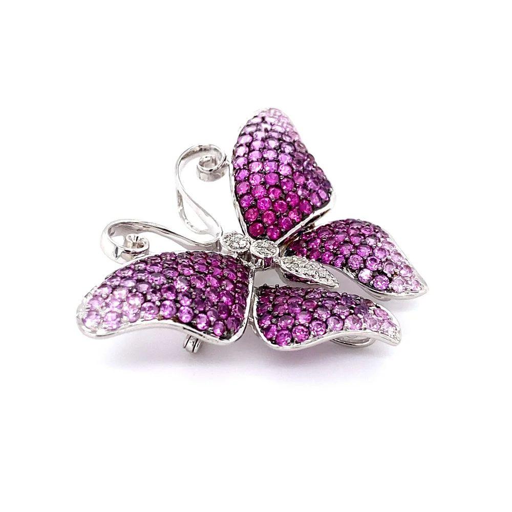 Simply Beautiful! Vintage Pink Sapphire and Diamond Butterfly Brooch. Hand set with Pink Sapphires, weighing approx. 4.40tcw and body with Diamonds, approx. 0.08tcw. Hand crafted in 18k White Gold. Measuring approx. sizes: 1.7” L. Outstanding in