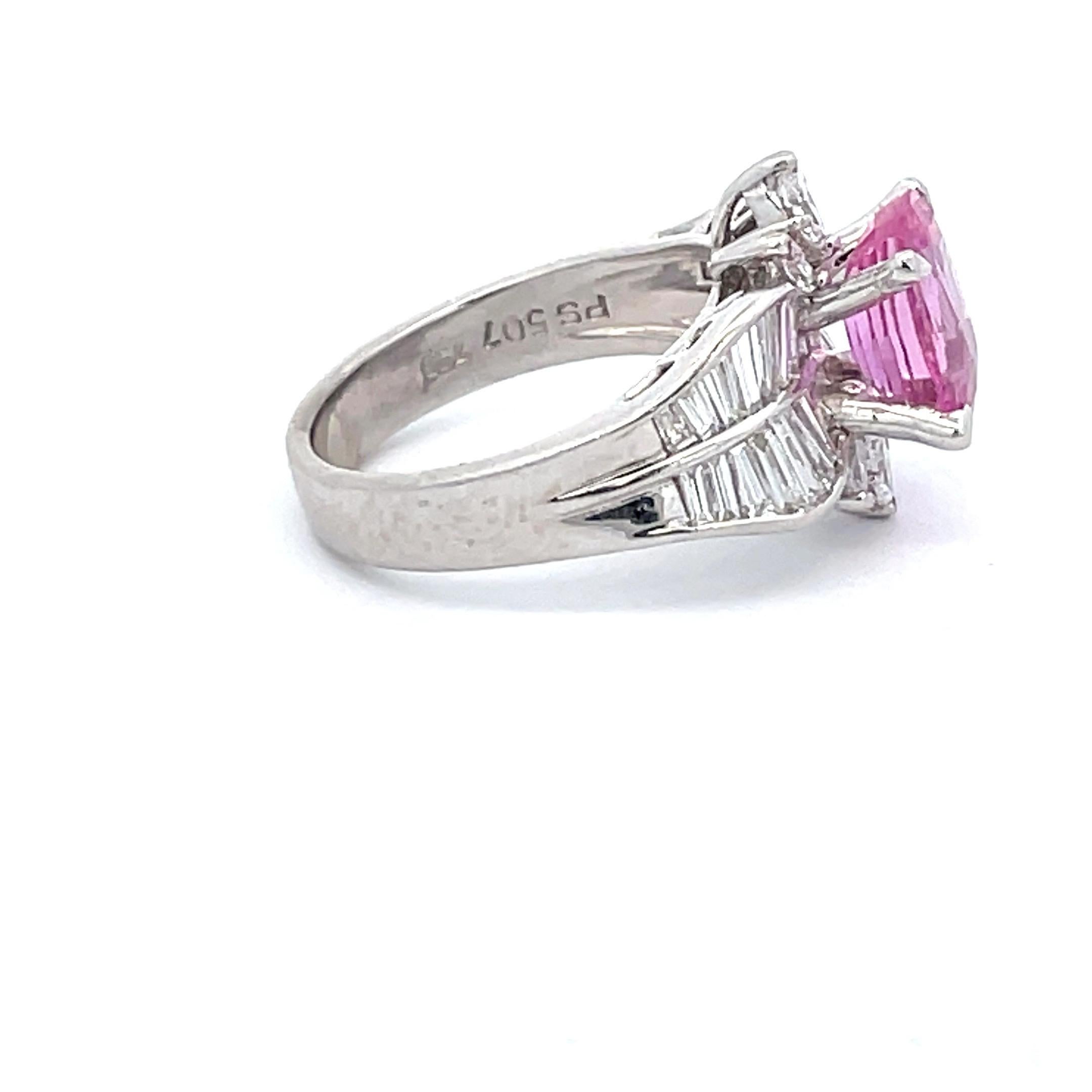 18 Karat White Gold cocktail ring featuring one elongated Cushion Cut Pink Sapphire weighing 2.93 Carats flanked with baguette & pear shape diamonds weighing approximately 2 Carats.

More Cocktail & Vintage Rings in stock.
DM for more pictures &