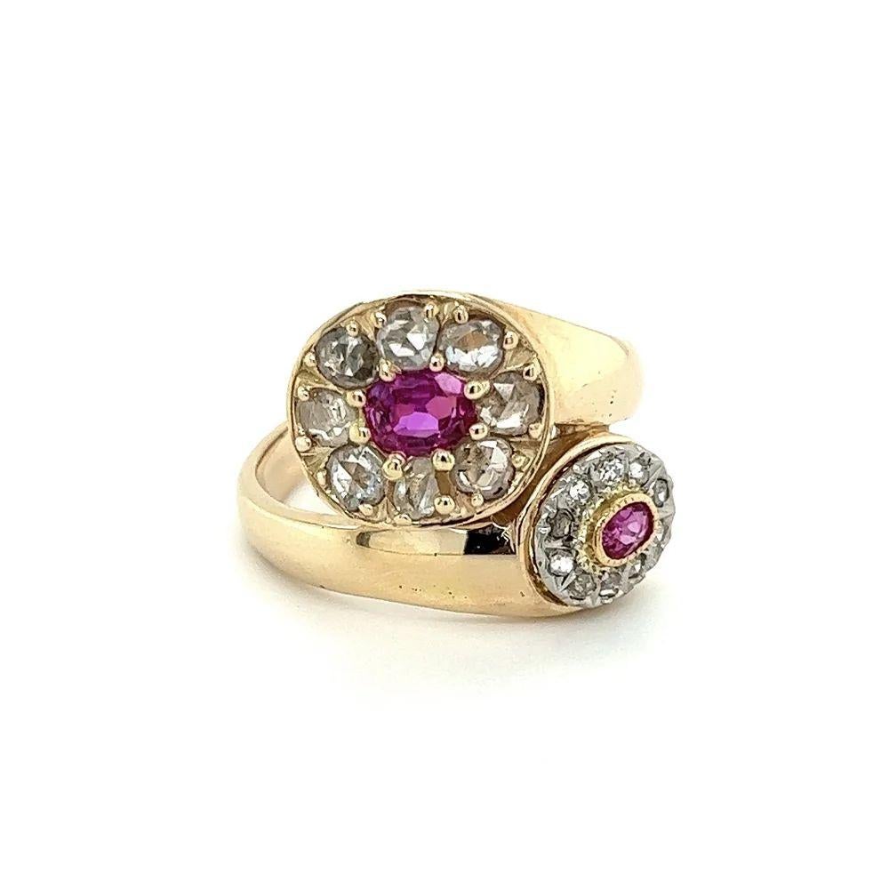 Simply Beautiful! 'Toi et Moi' Pink Sapphire and Diamond Gold Bypass Ring. Hand set with two Pink Sapphire Gemstones, weighing 0.85tcw and Rose cut Diamonds weighing approx. 1.30tcw. Hand crafted 14K Yellow Gold mounting. Ring size: 9, we offer ring