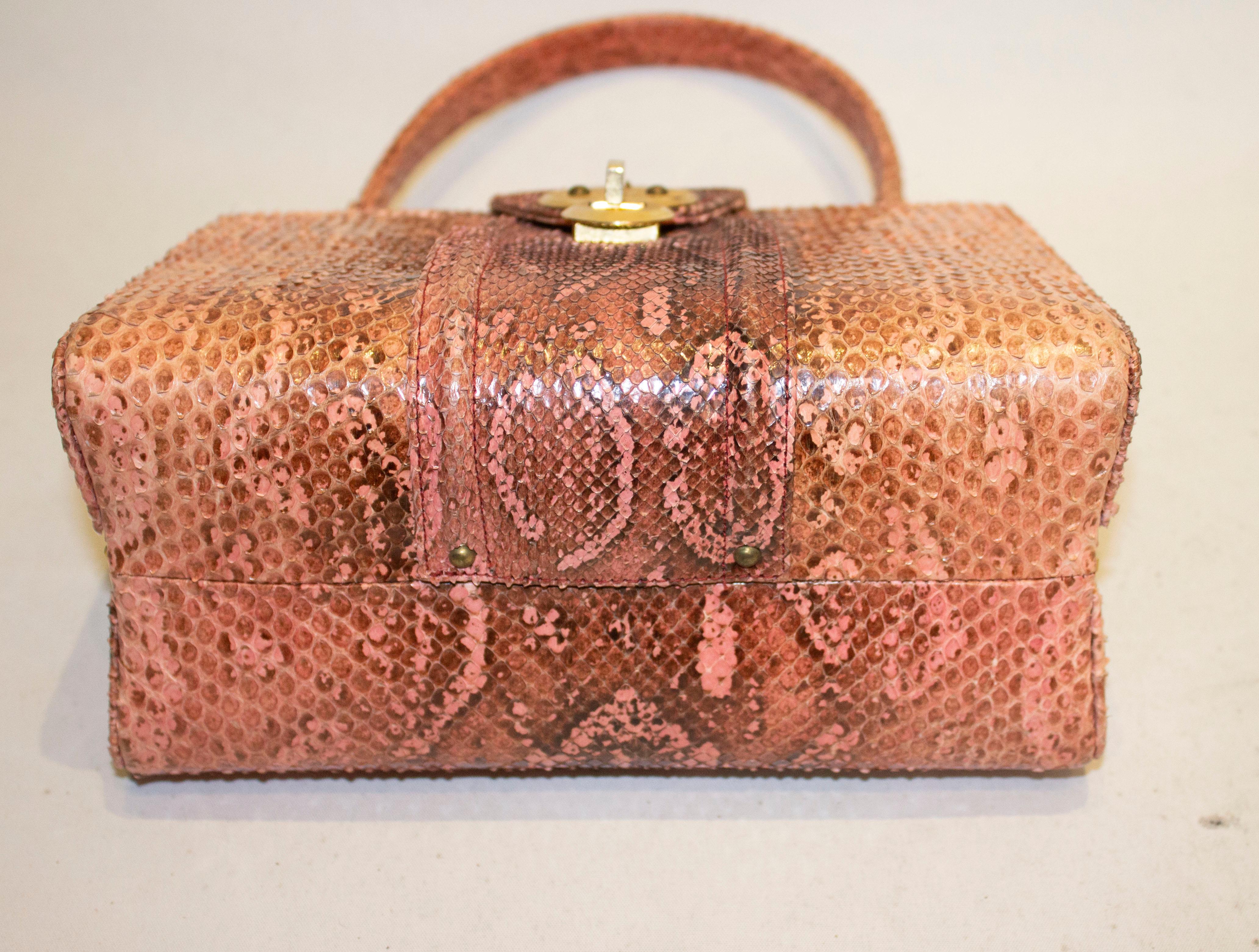 pink snakeskin handbag