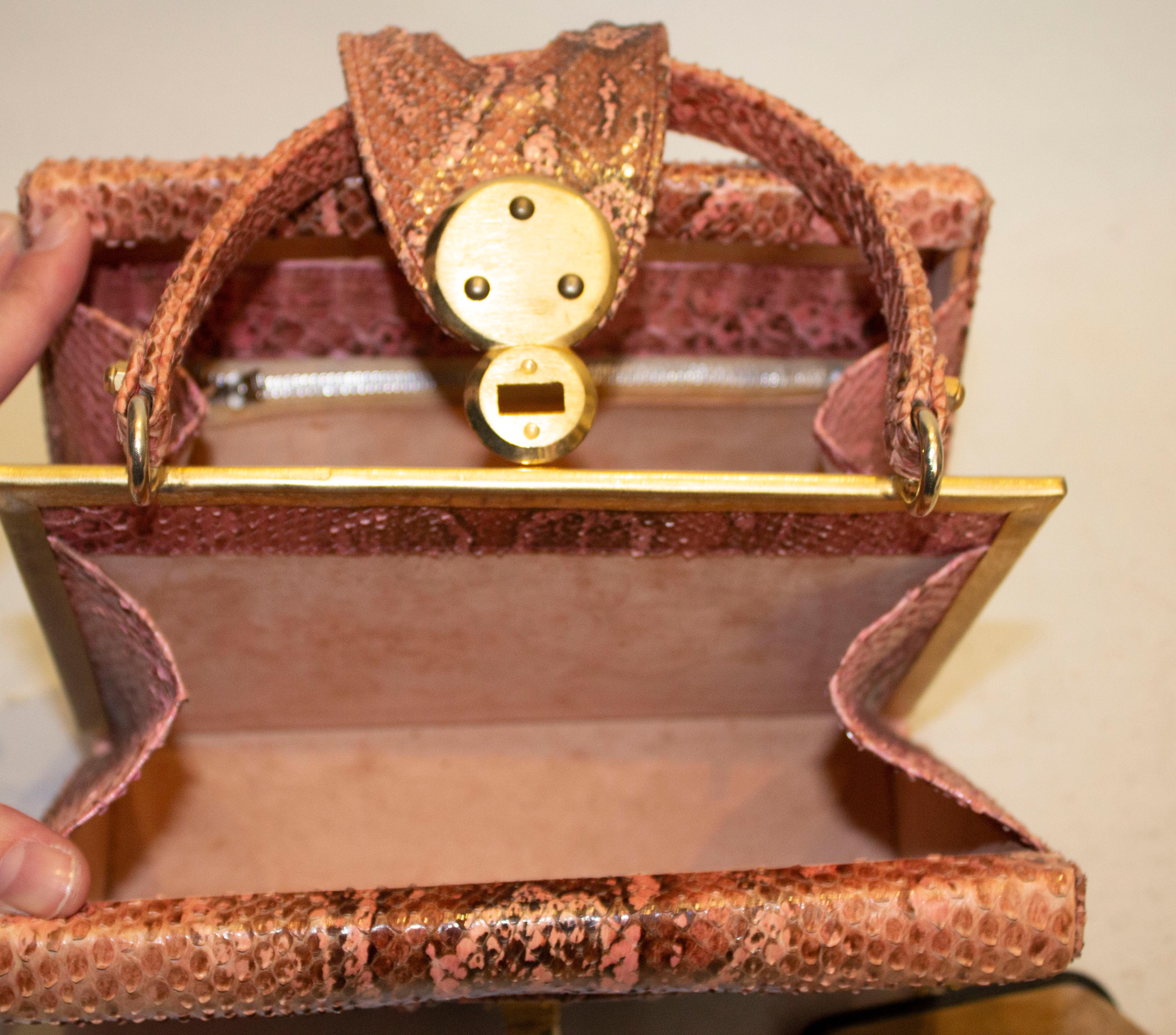 pink snakeskin purse