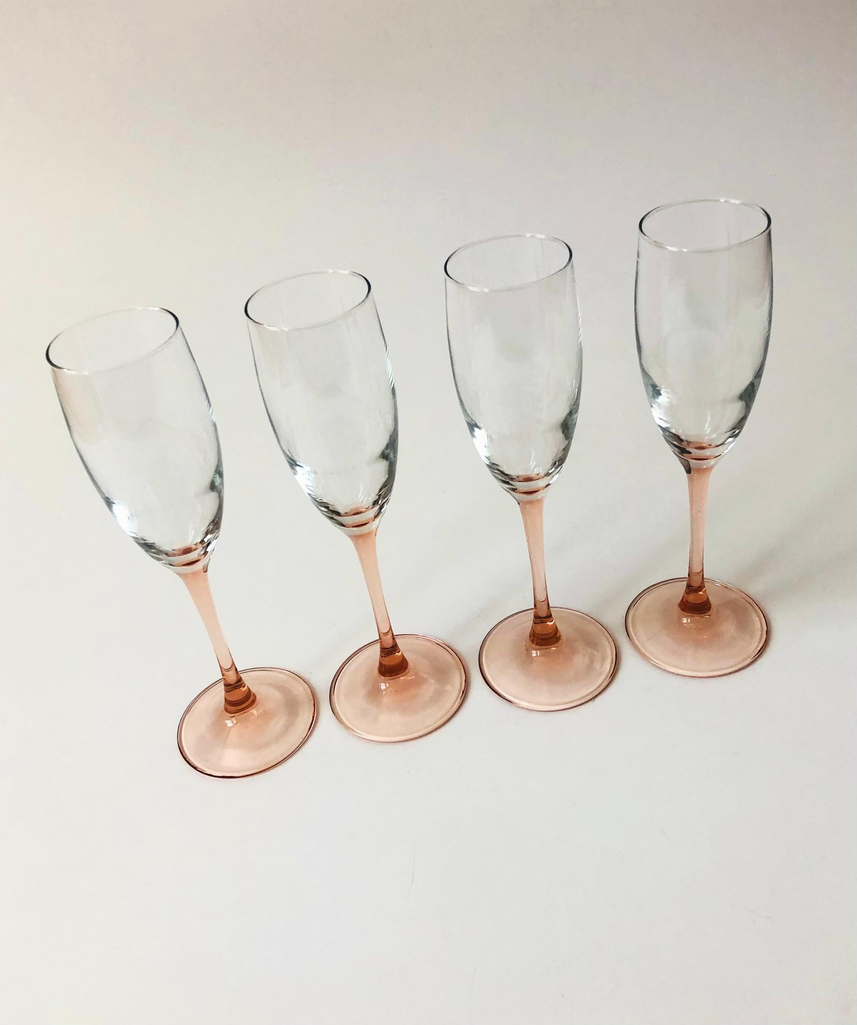 A lovely set of 4 vintage pale pink stemmed champagne flutes. Made in France.
    