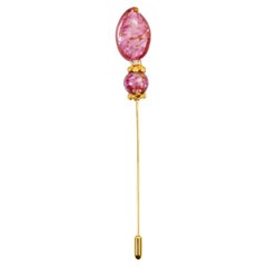 Spilla con pietra rosa d'epoca e diamante in tonalità oro, circa anni '90