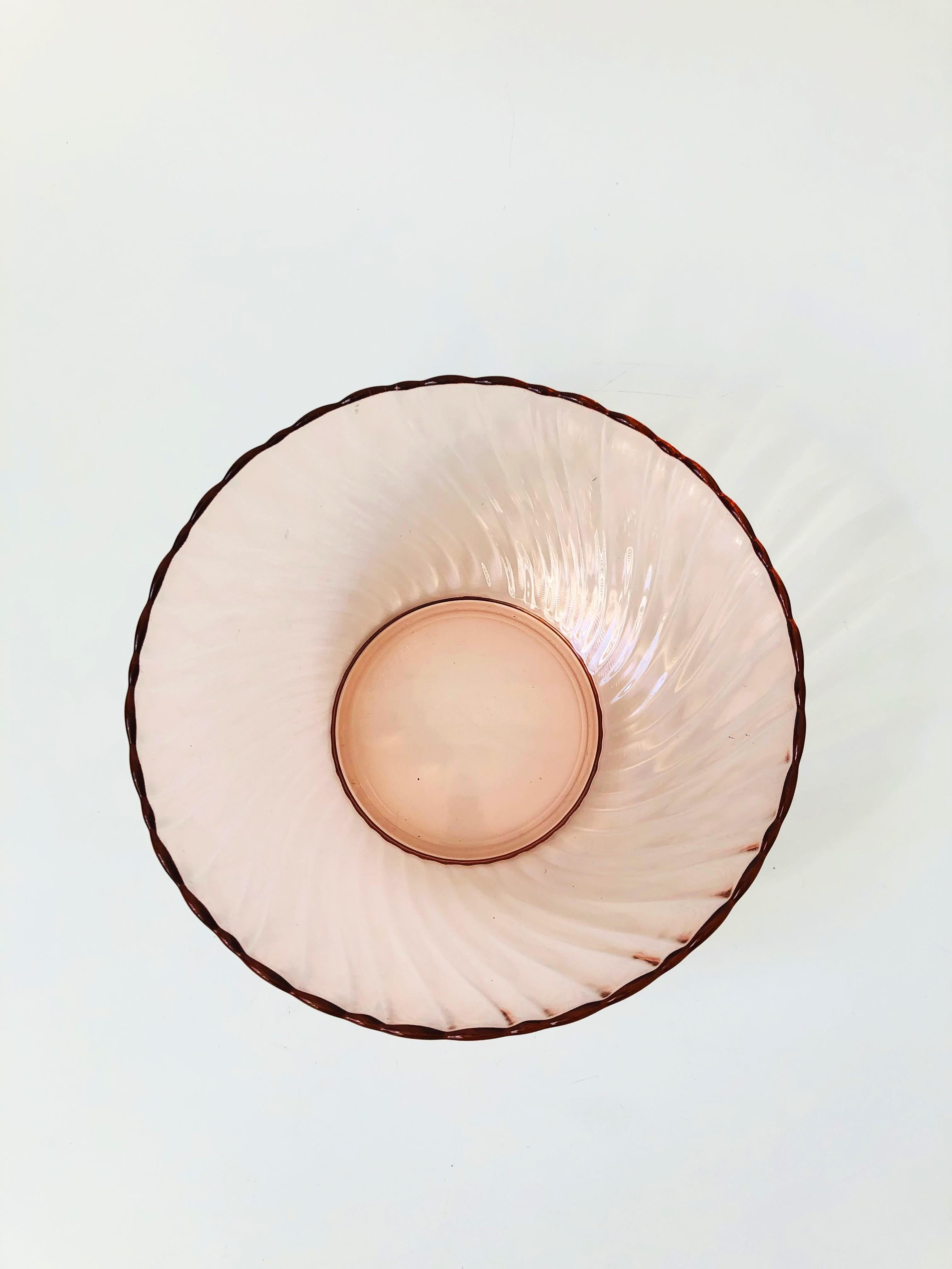 A gorgeous vintage blush pink large salad bowl. Made in France by Arcoroc in the rosaline swirl pattern.
 