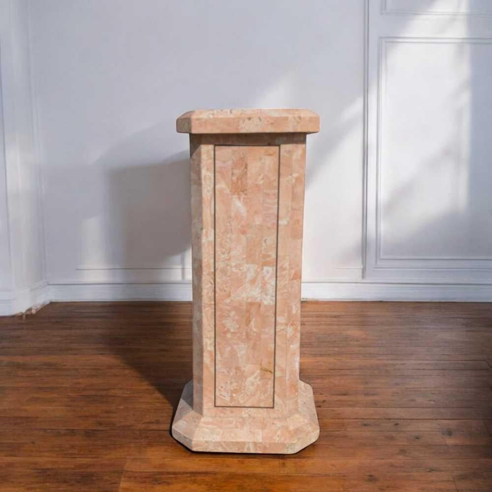 A distinctive pedestal in the 1980s modern tradition, crafted from pink tessellated marble and showcasing a soft pink hue with natural veining. This piece blends timeless design with quality craftsmanship—ideal for use as a display stand for plants,