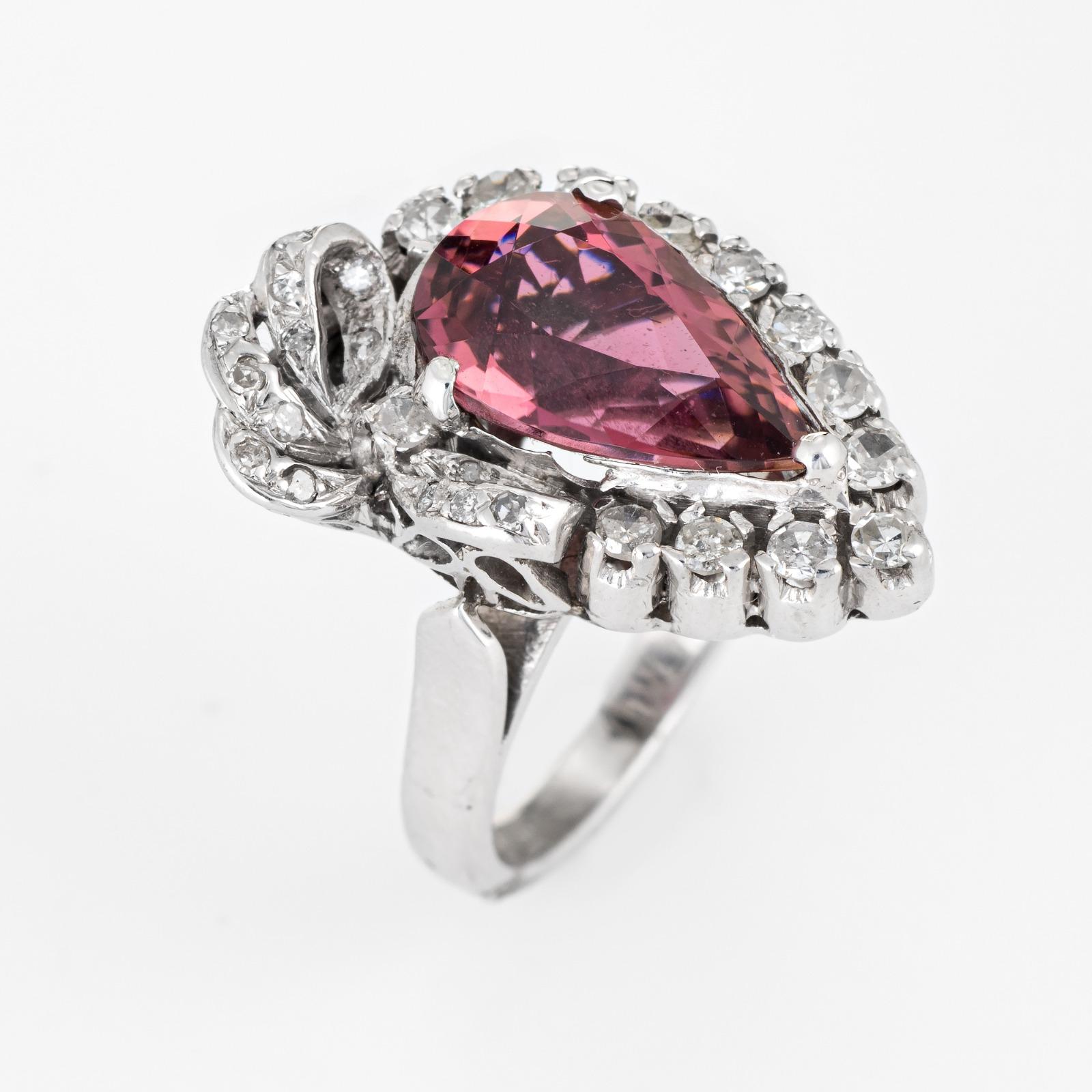 Stylish vintage pink tourmaline & diamond cocktail ring (circa 1940s to 1950s), crafted in 10 karat white gold

One pear cut pink tourmaline is estimated at 3 carats, accented with an estimated .24 carats of diamonds (estimated at J-K color and I1-3
