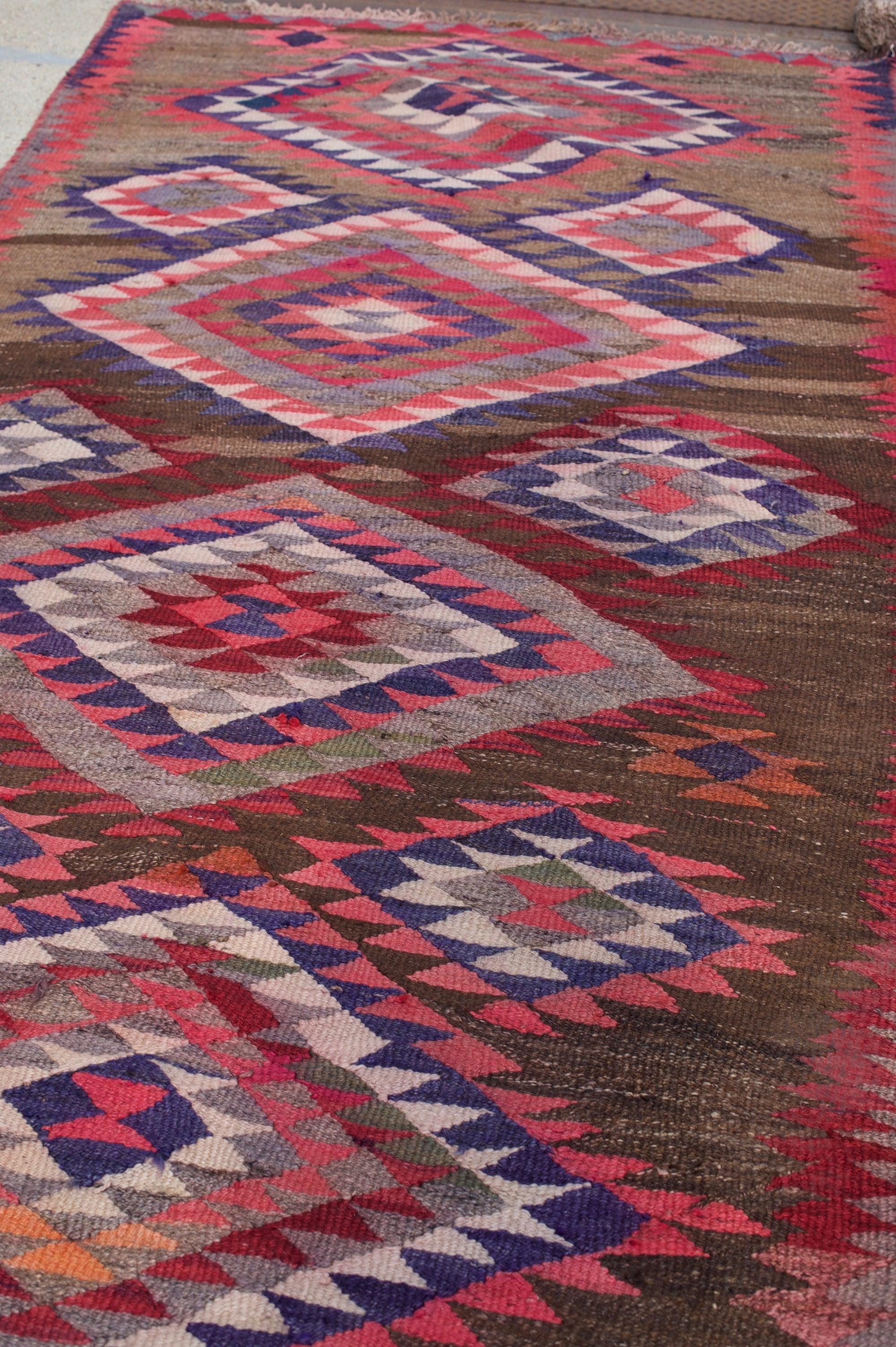 Kelly Vintage Pink Tribal Kilim Rug

About: Very fun & happy rug! This rug has a nice body, unlike other and most Kilims. The rug can be used on both sides (reversible), and there is some subtle discoloration on some areas (color run), but nothing
