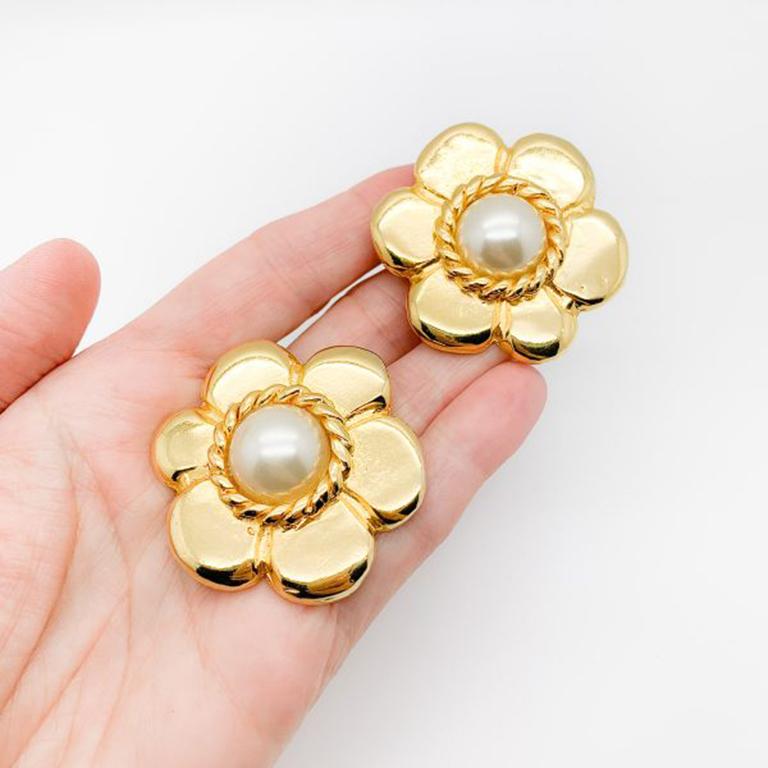 Vintage Pinky Paris Flower Earrings. Striking Parisian clip on earrings with a glamorous flower power feel. Featuring high quality gold plated metal with a central simulated half pearl. Signed, in very good vintage condition, 4.5cm. A stunning pair