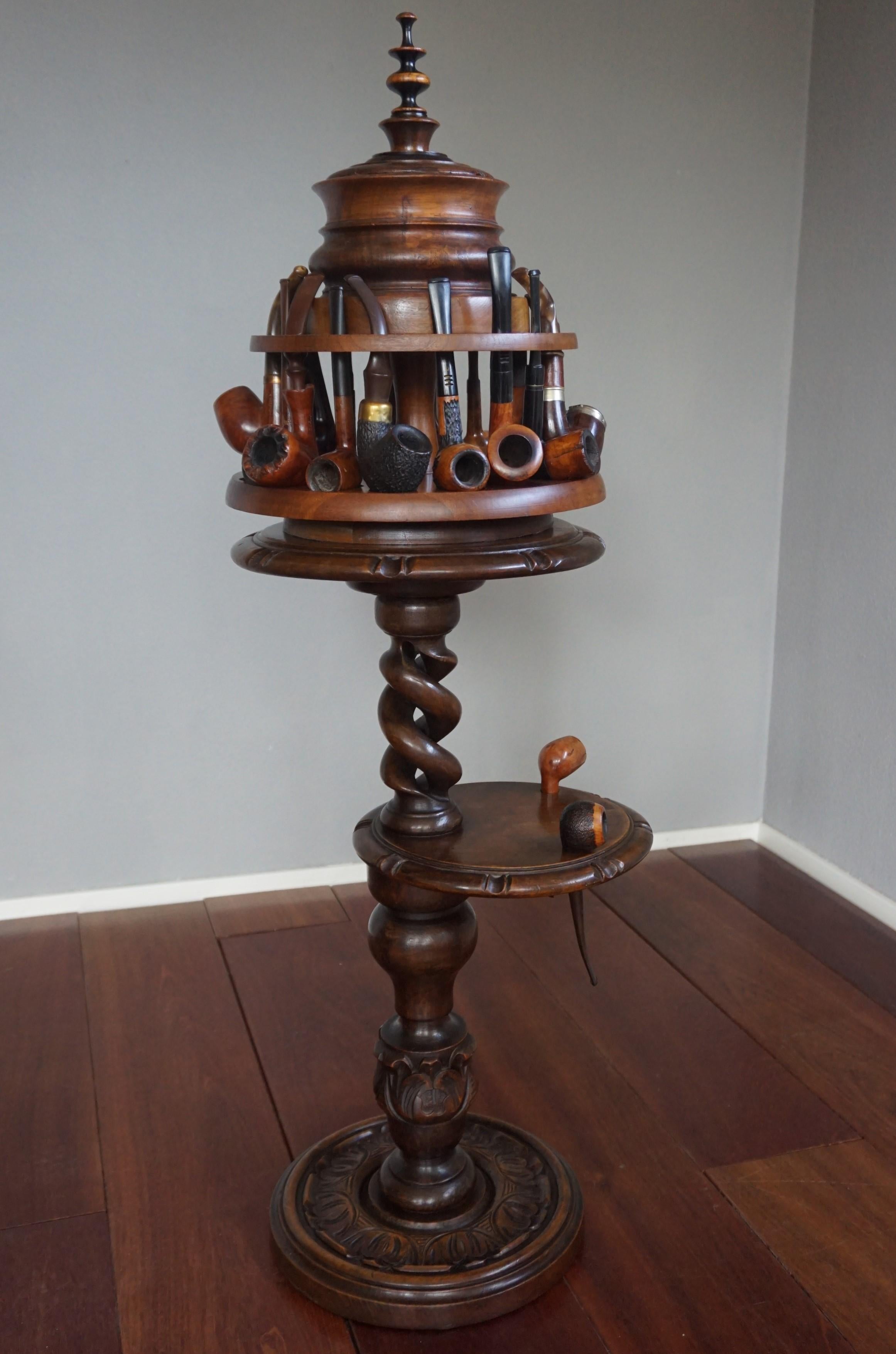 Collection of items for pipe or tobacco smokers. 

This beautiful collection for pipe smoking enthusiasts consists of 21 individual pieces in total. First of all, there is the antique wooden pipe stand with the extra tier with two holes for carrying