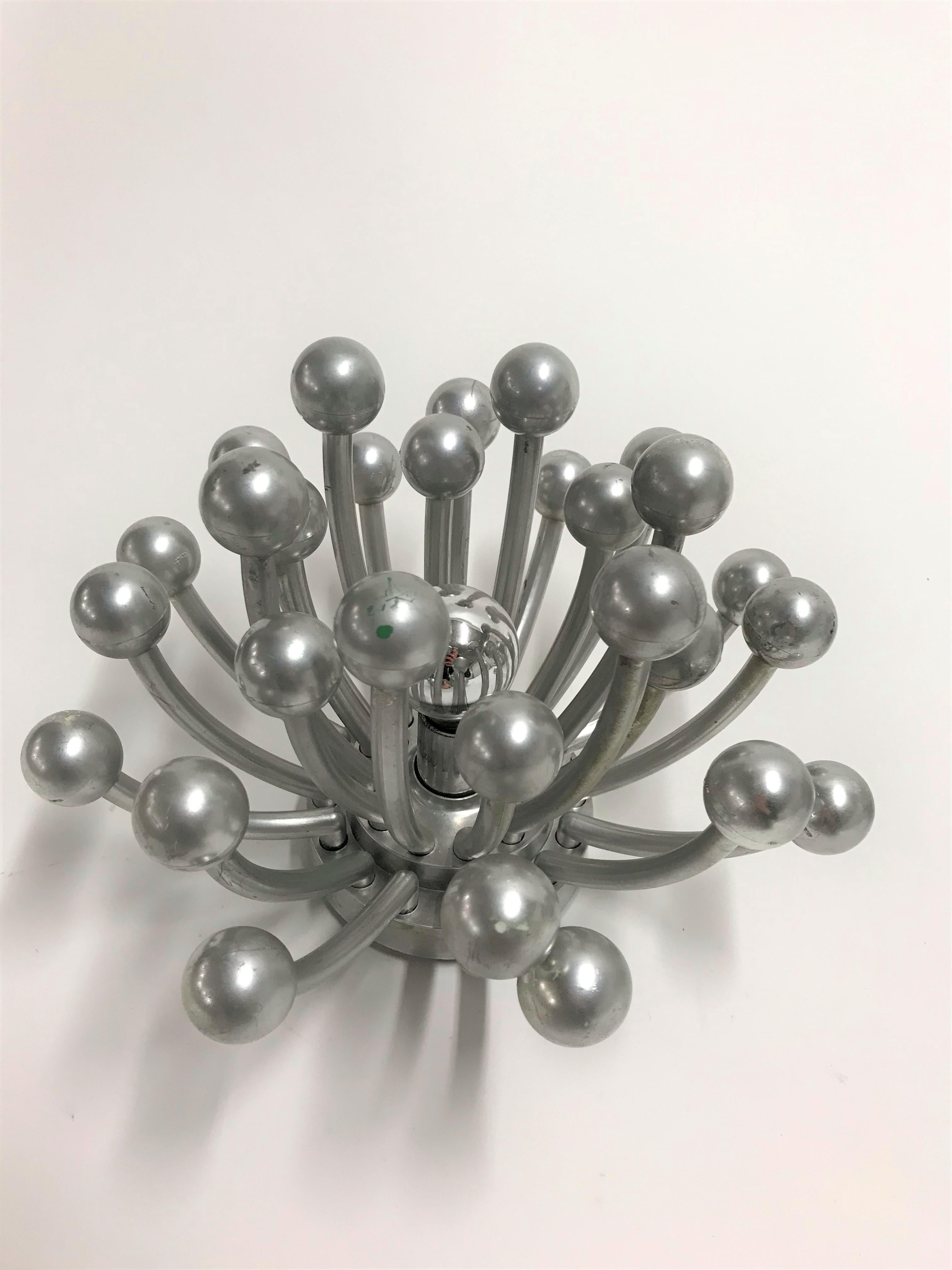 Stunning Pistillo Sputnik wall lamps designed by Studio Tetrach.

These lamps can be used as a table lamp or even as a wall or ceiling light.

It emits a spectacular light.

Good condition, slight patina

1969, Italy

Measures: Diameter